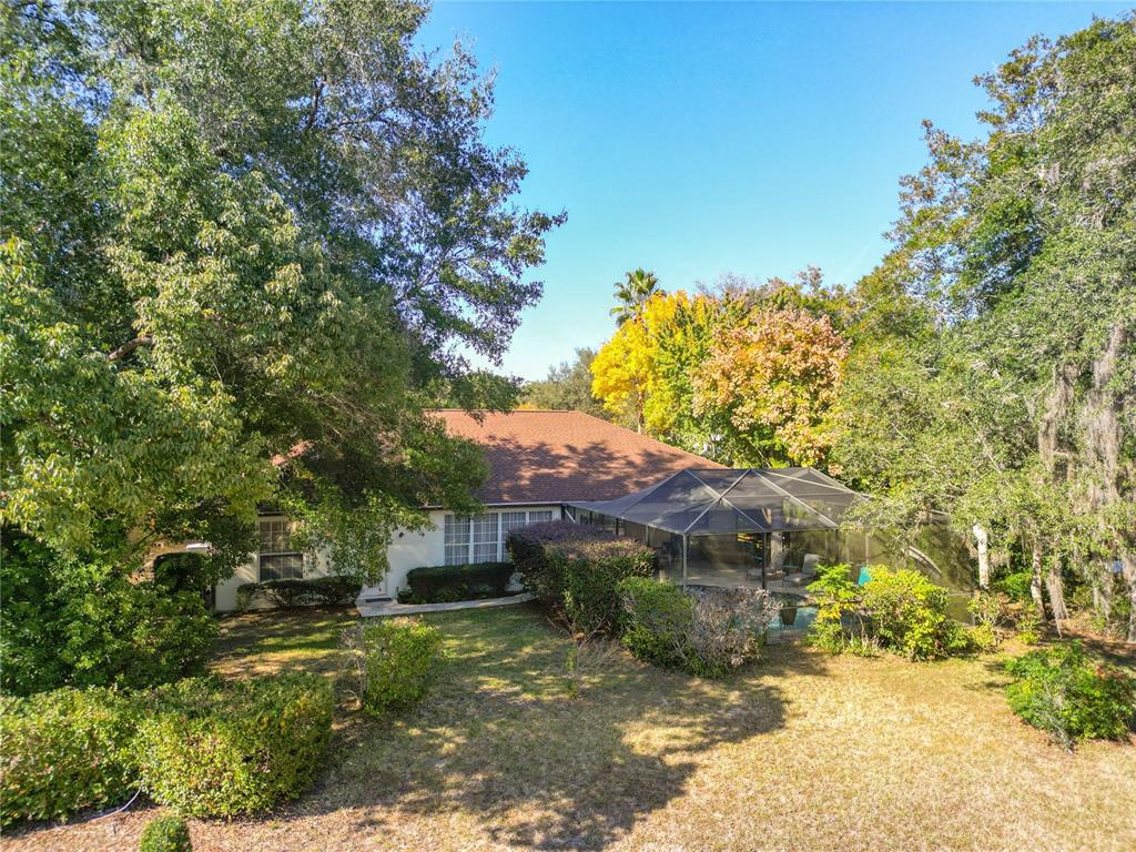 9027 Southwest 196th Court Dunnellon, FL 34432 - Photo 45 of 50 a view of a house with a tree in the background