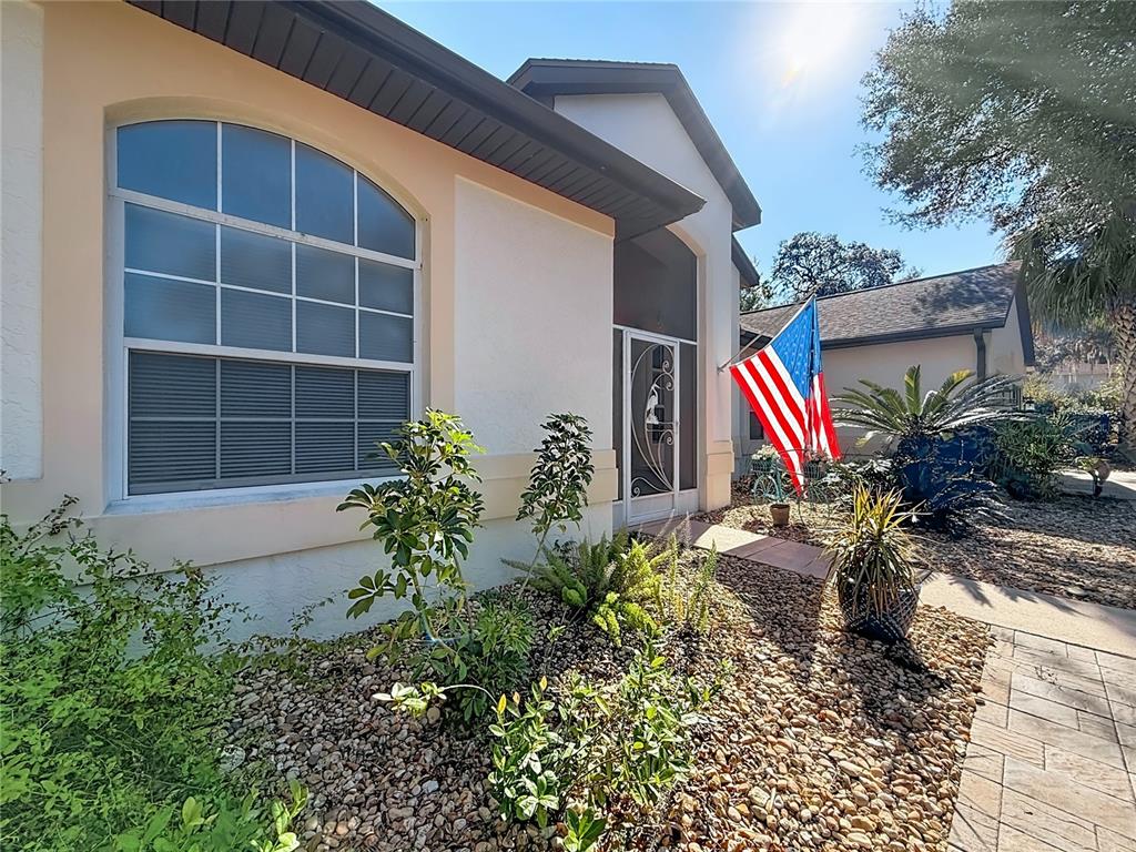 9027 Southwest 196th Court Dunnellon, FL 34432 - Photo 5 of 50 a front view of a house with a yard