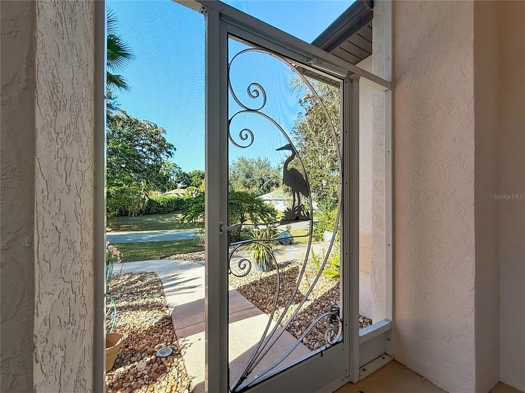 9027 Southwest 196th Court Dunnellon, FL 34432 - Photo 6 of 50 a front view of a house with a big yard and potted plants