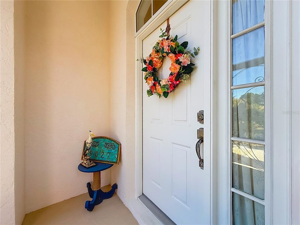 9027 Southwest 196th Court Dunnellon, FL 34432 - Photo 7 of 50 view of a hallway with wooden floor and a potted plant
