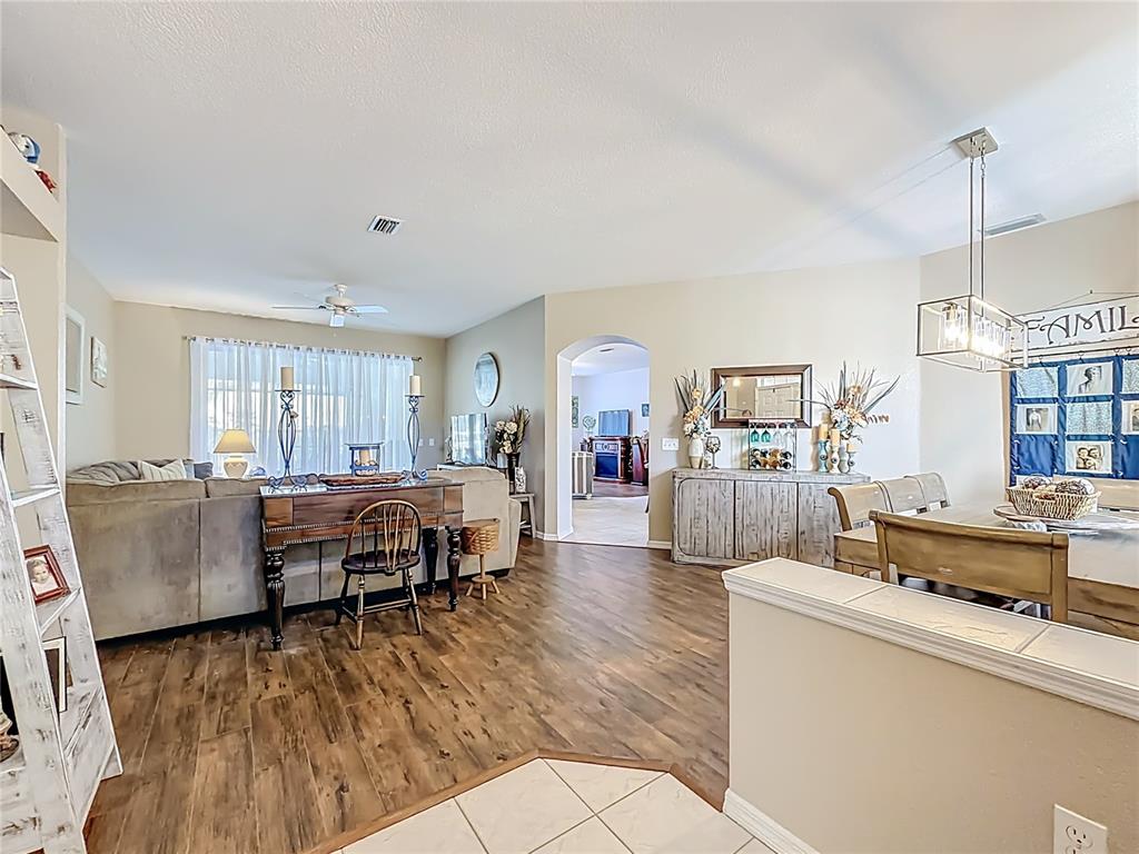 9027 Southwest 196th Court Dunnellon, FL 34432 - Photo 10 of 50 a living room with furniture and a flat screen tv