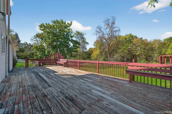 a view of a deck with a yard