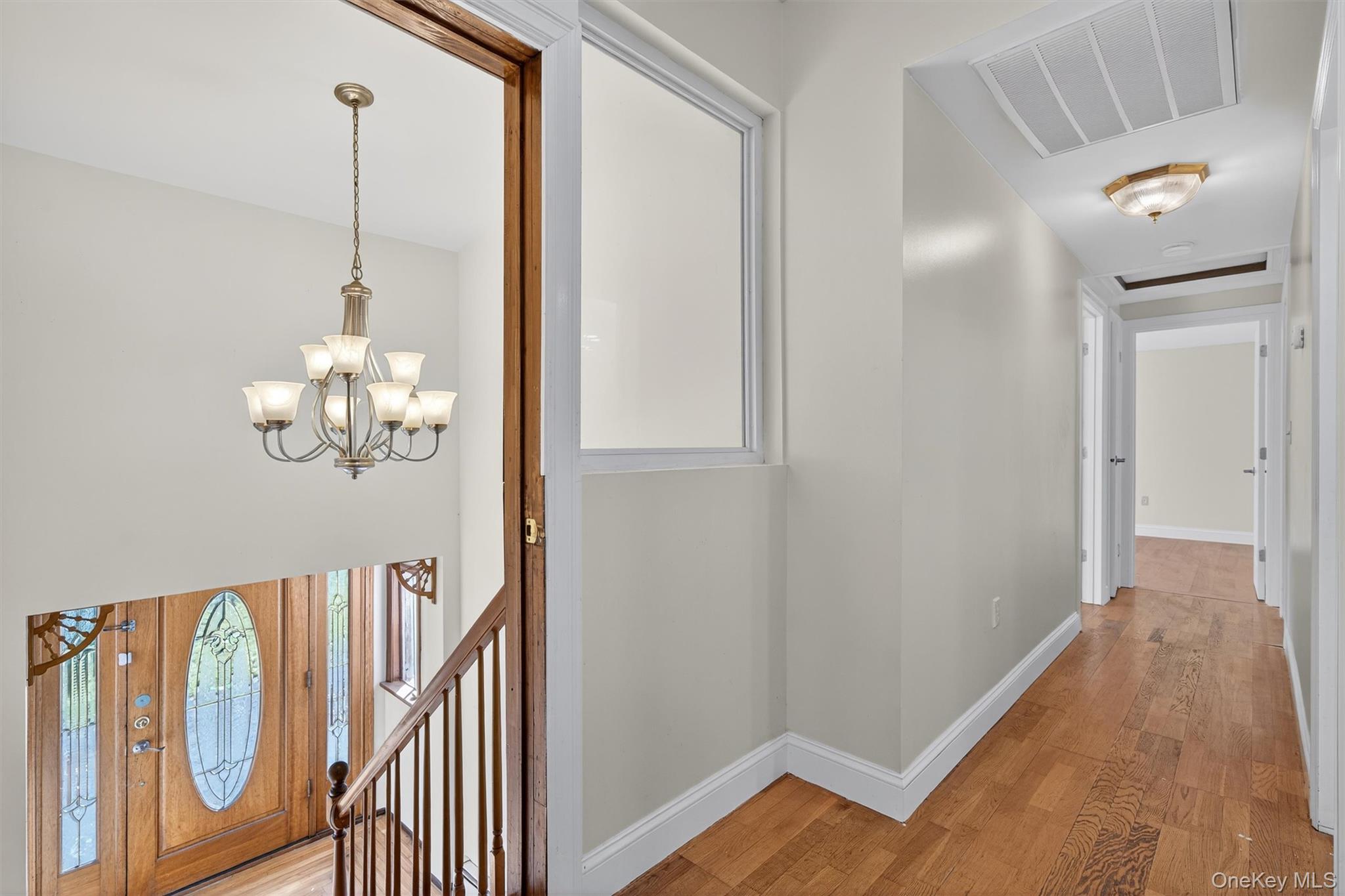 229 Gardnerville Road New Hampton, NY 10958 - Photo 14 of 50 a view of a hallway with wooden floor and staircase