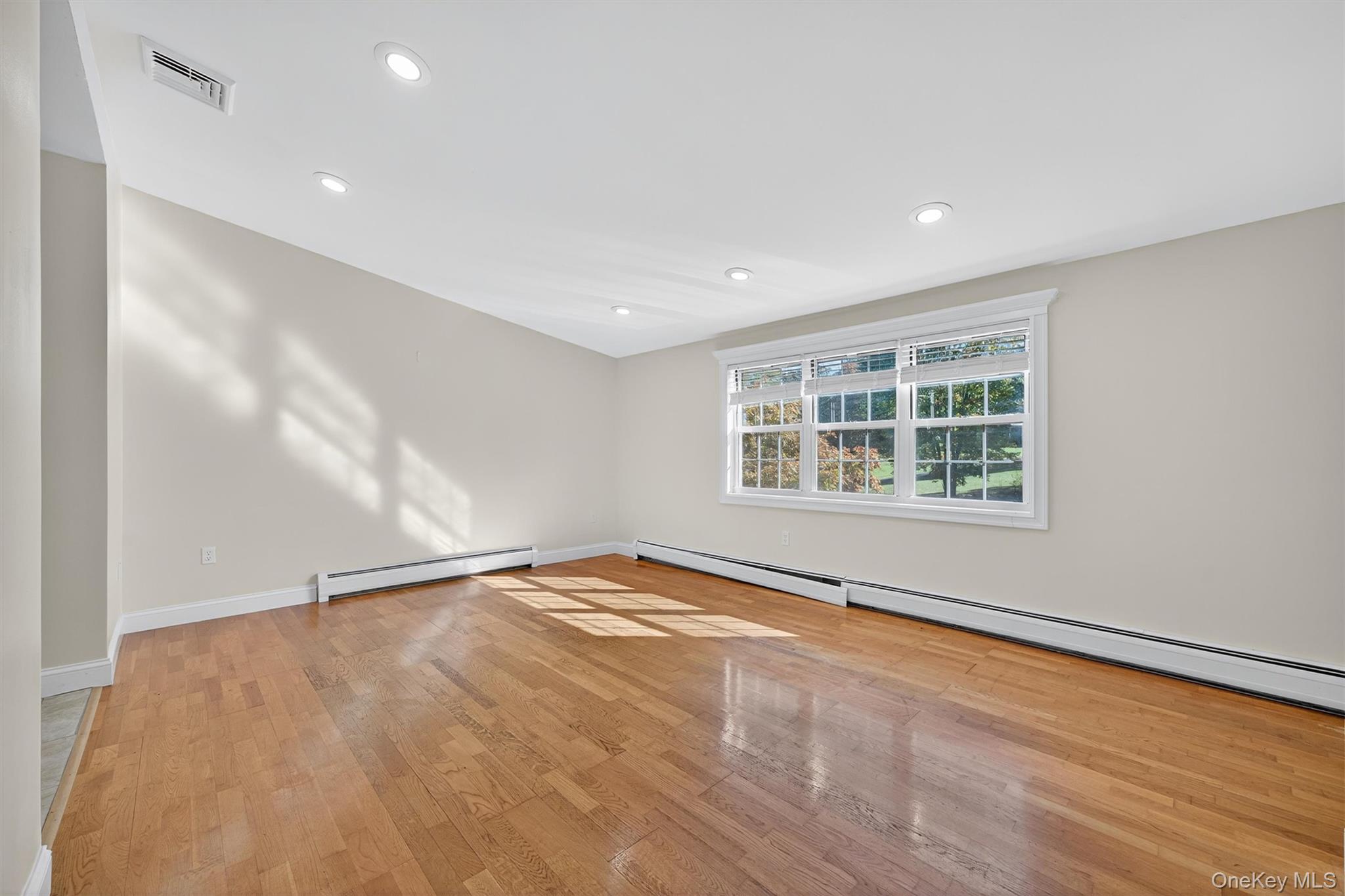 229 Gardnerville Road New Hampton, NY 10958 - Photo 15 of 50 wooden floor in an empty room with a window