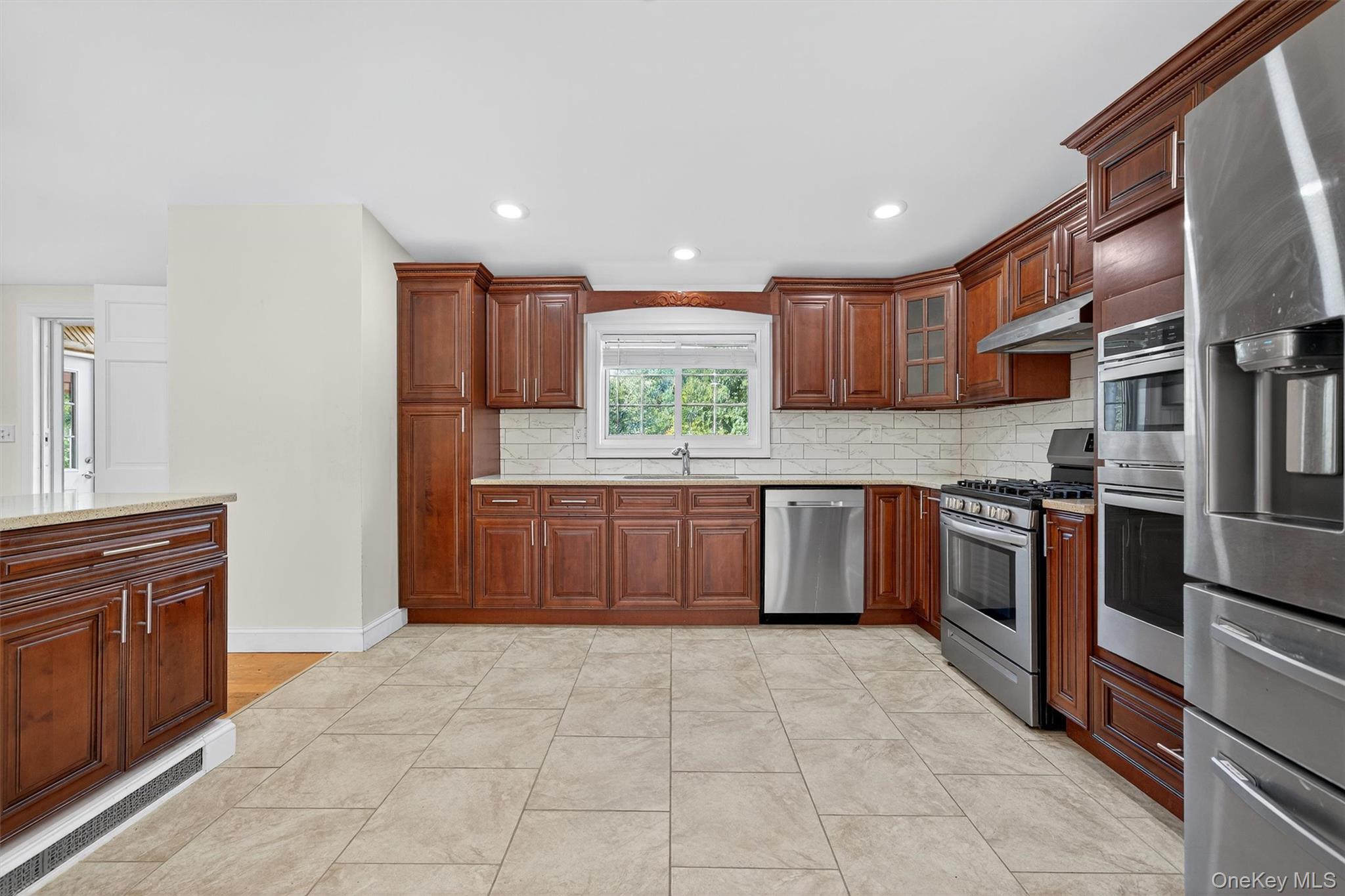 229 Gardnerville Road New Hampton, NY 10958 - Photo 17 of 50 a kitchen with stainless steel appliances granite countertop a stove sink and cabinets