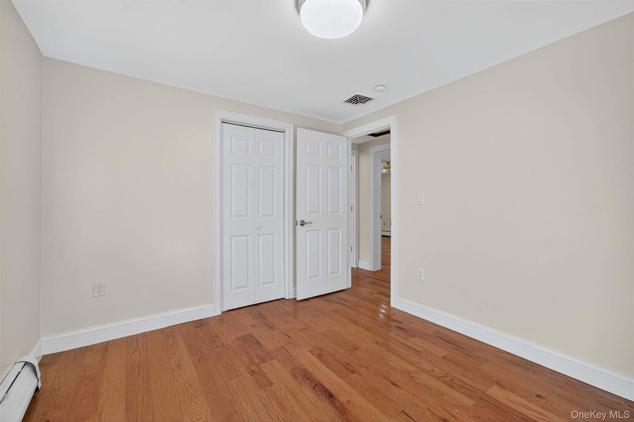 229 Gardnerville Road New Hampton, NY 10958 - Photo 28 of 50 a view of an empty room with wooden floor