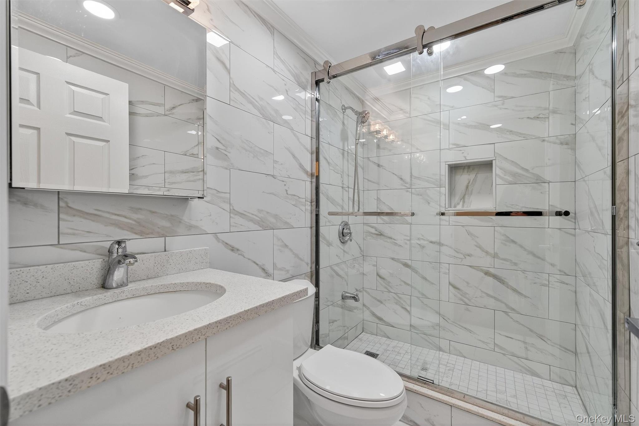 229 Gardnerville Road New Hampton, NY 10958 - Photo 29 of 50 a bathroom with a sink a toilet and shower