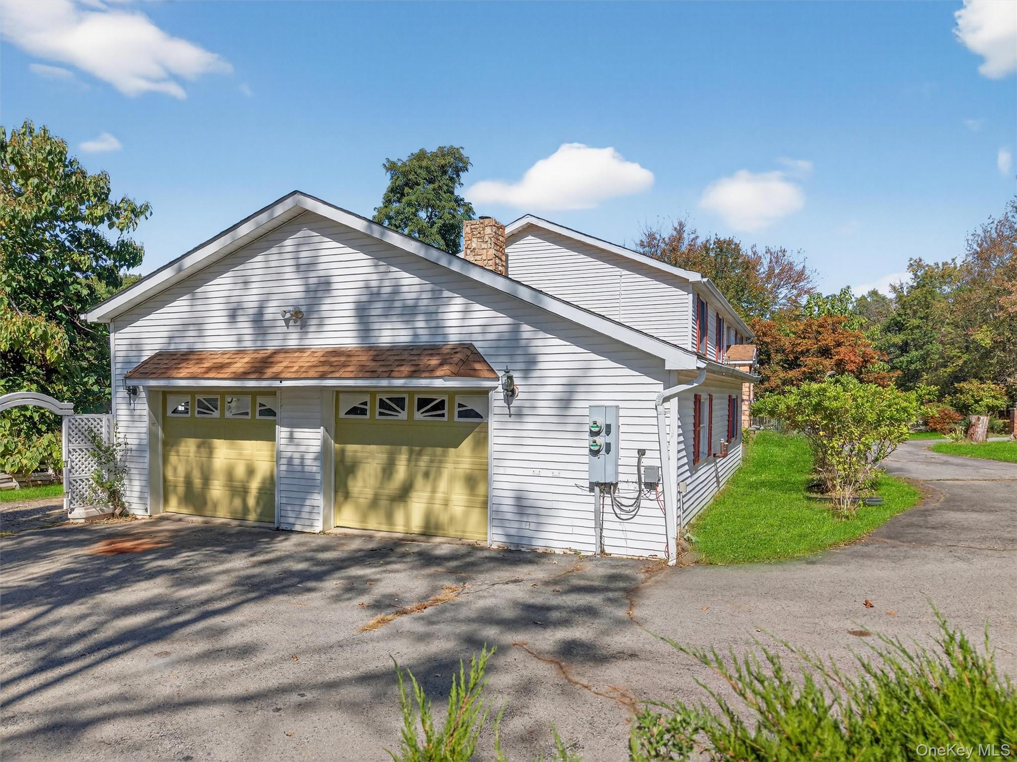 229 Gardnerville Road New Hampton, NY 10958 - Photo 3 of 50 a front view of a house with garden