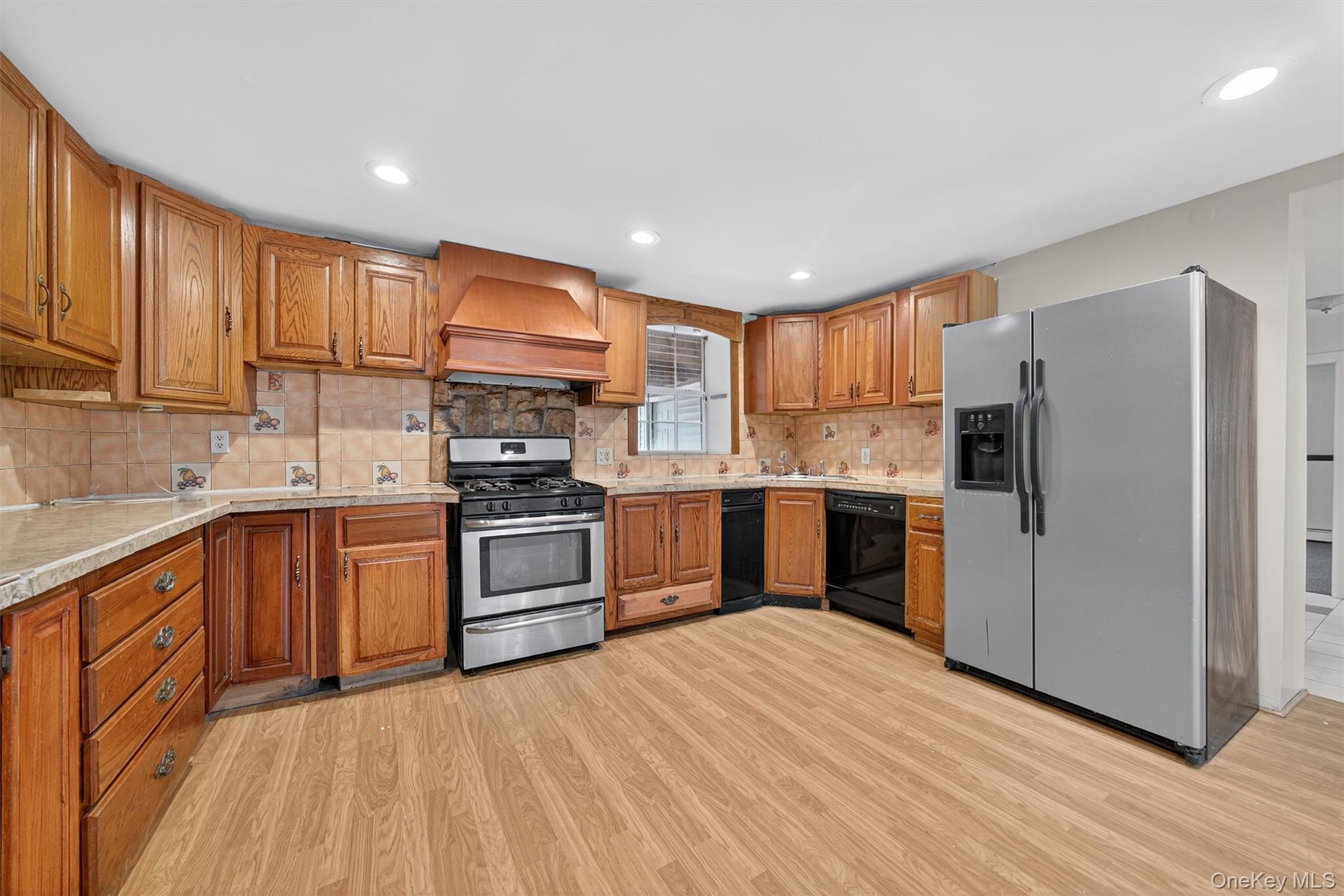 229 Gardnerville Road New Hampton, NY 10958 - Photo 31 of 50 a kitchen with stainless steel appliances granite countertop a refrigerator stove top oven and sink