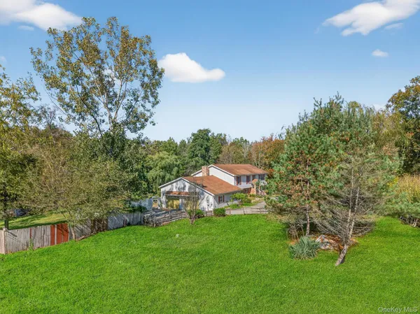 a view of a garden with a building in the background