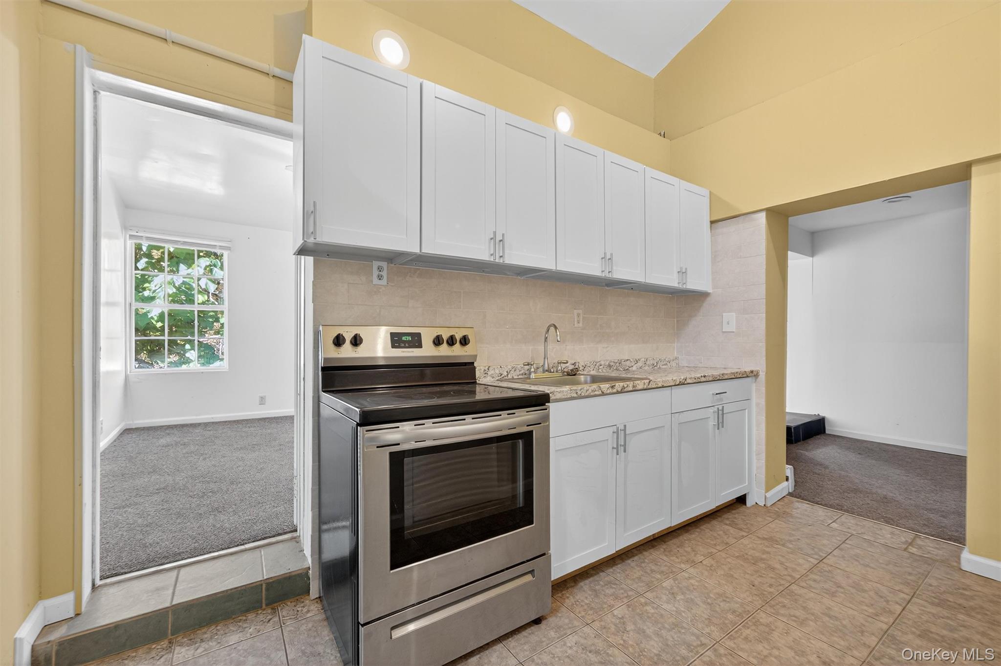 229 Gardnerville Road New Hampton, NY 10958 - Photo 41 of 50 a kitchen with granite countertop white cabinets stainless steel appliances and sink