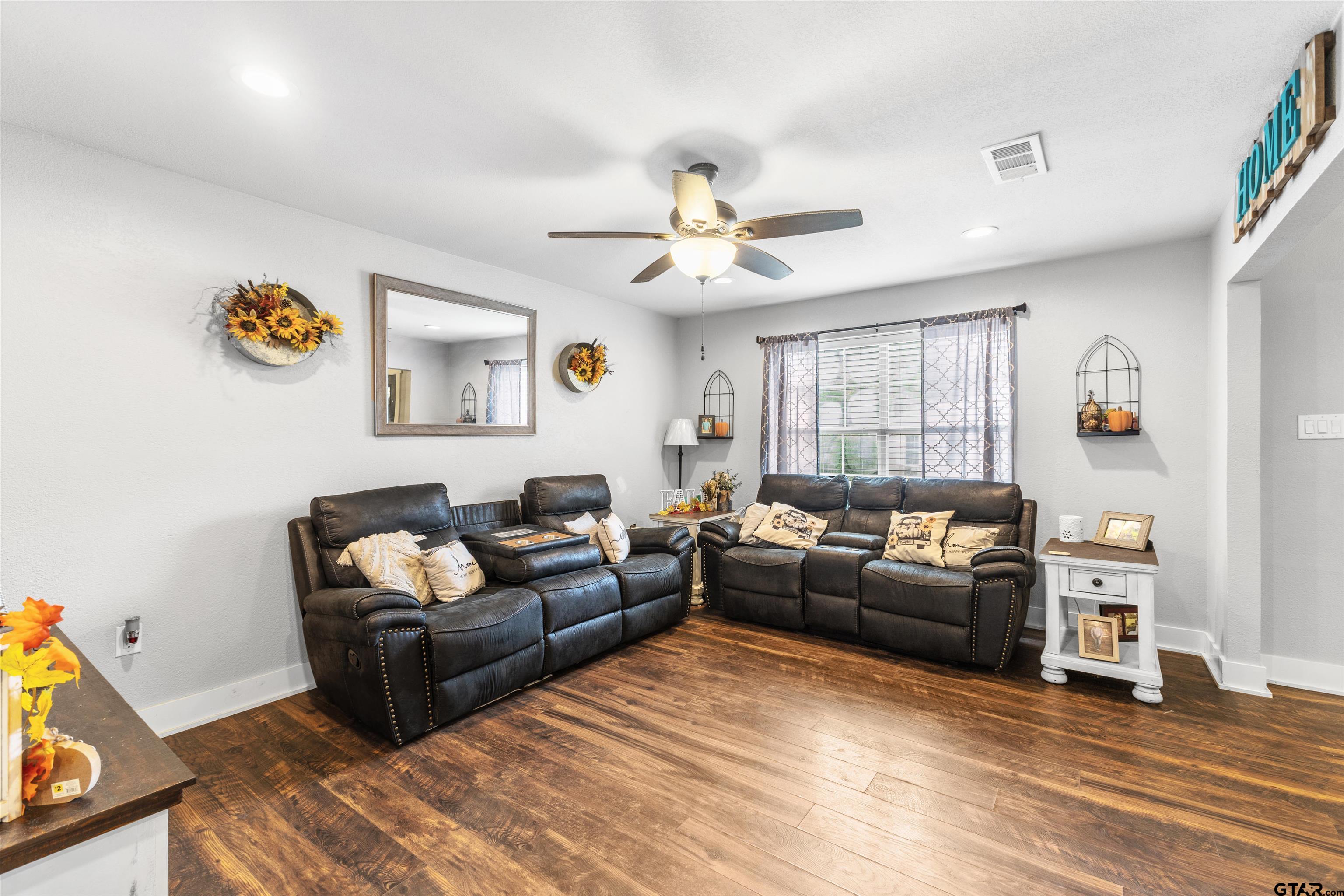 106 Pecan Ridge Mount Vernon, TX 75457 - Photo 9 of 31 a living room with furniture and a wooden floor