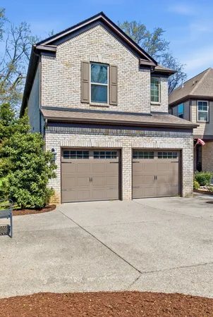 a front view of a house with a garage