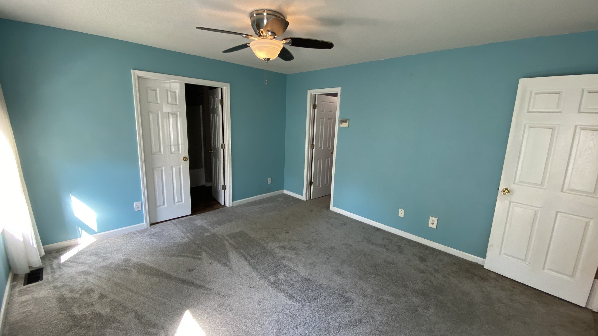 3475 Eastridge Road Woodlawn, TN 37191 - Photo 15 of 20 a view of a livingroom with a ceiling fan and window