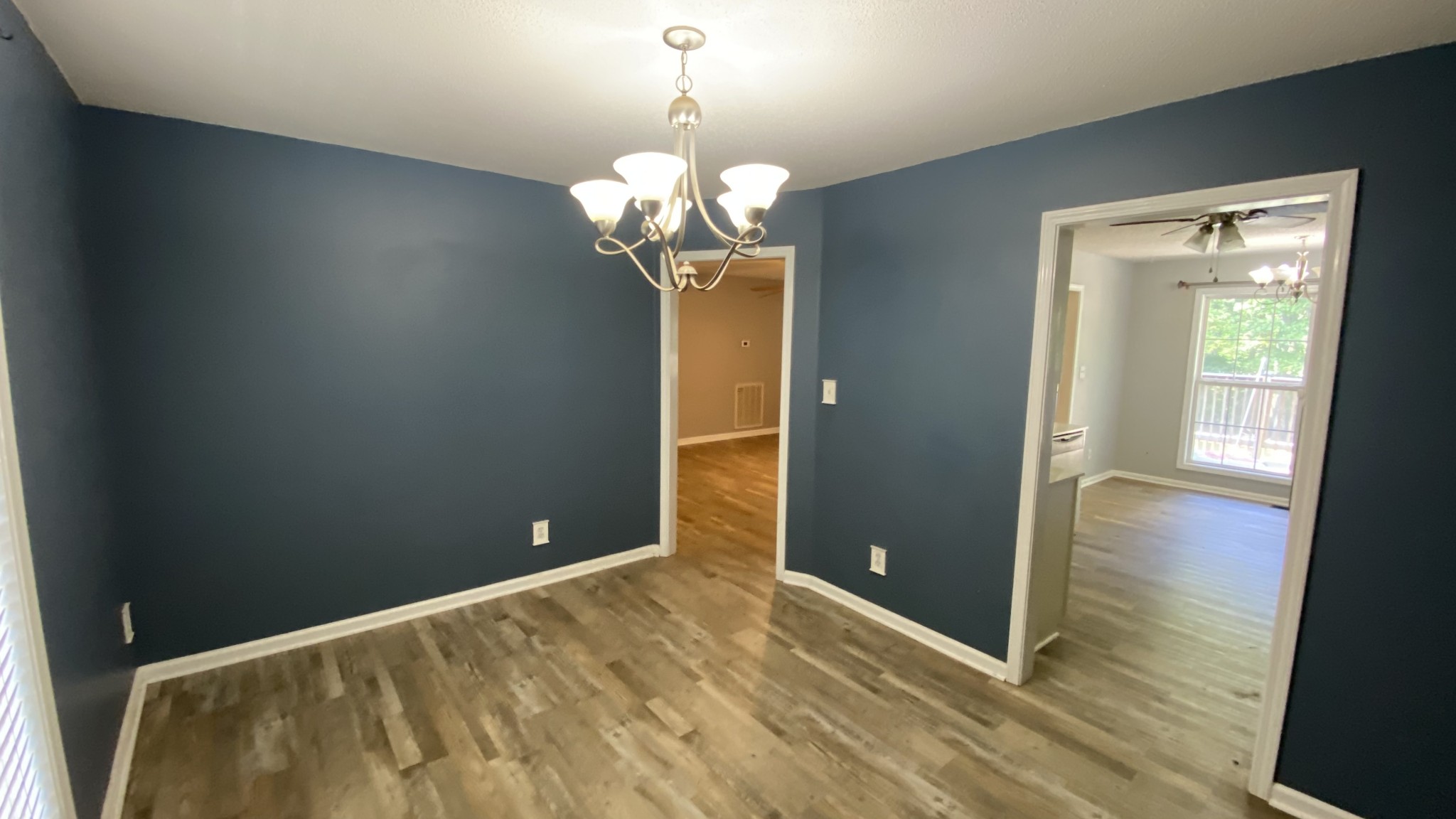 3475 Eastridge Road Woodlawn, TN 37191 - Photo 5 of 20 a view of a livingroom with a chandelier