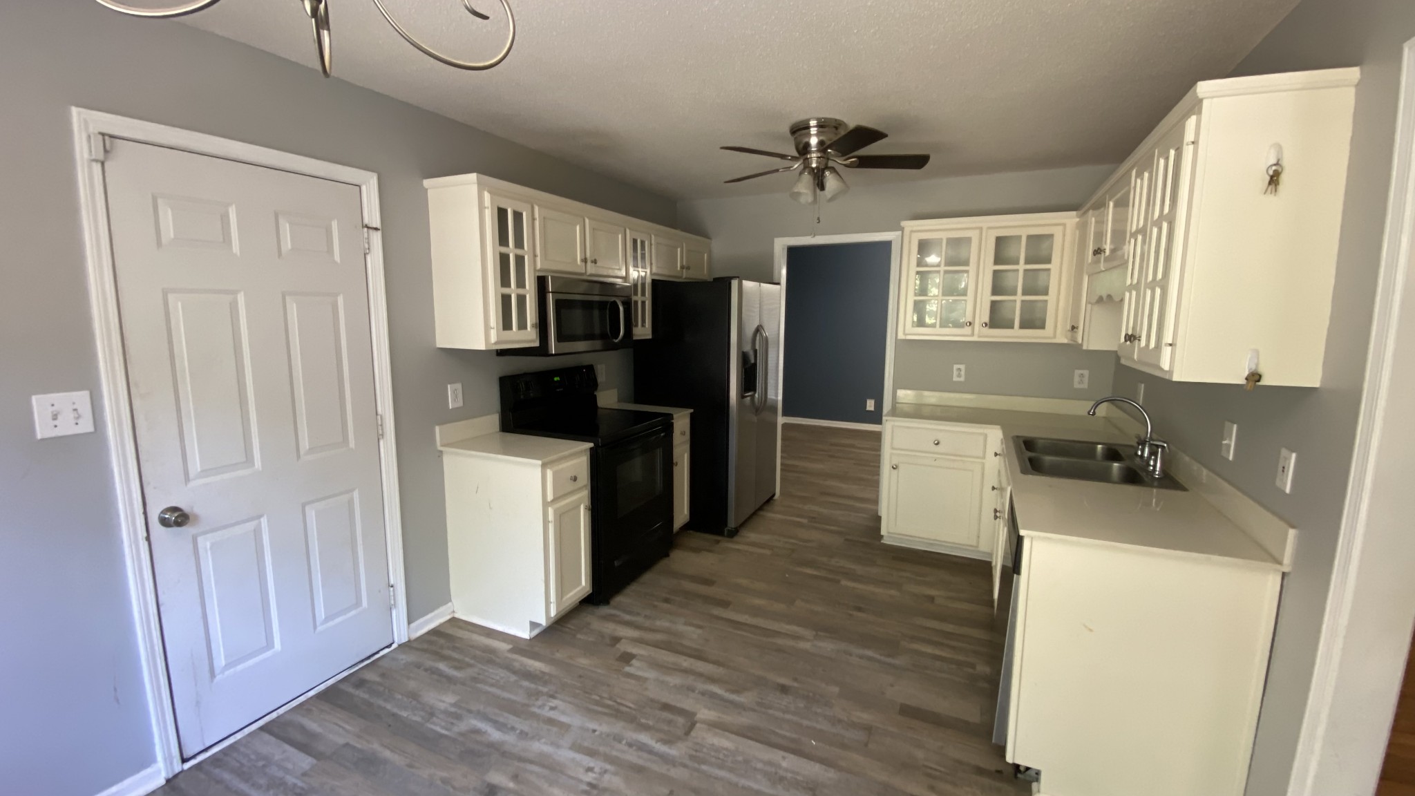 3475 Eastridge Road Woodlawn, TN 37191 - Photo 8 of 20 a kitchen with a refrigerator and a sink
