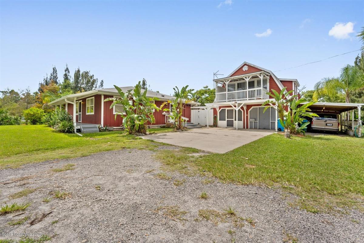 3600 Leghorn Road Grant Valkaria, FL 32950 - Photo 2 of 33 a front view of house with yard and green space