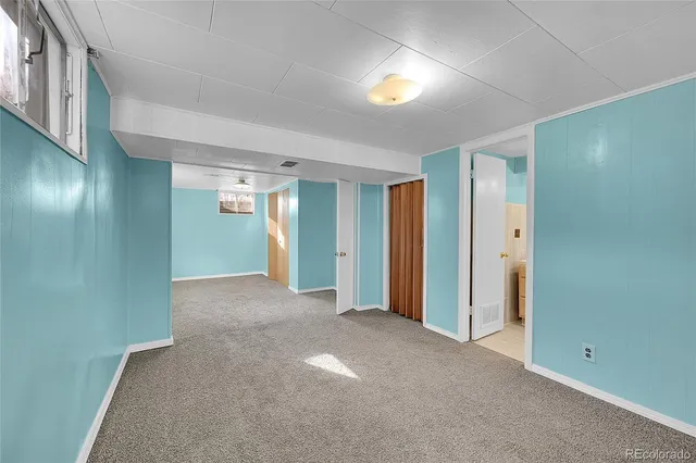 a view of livingroom and an empty room