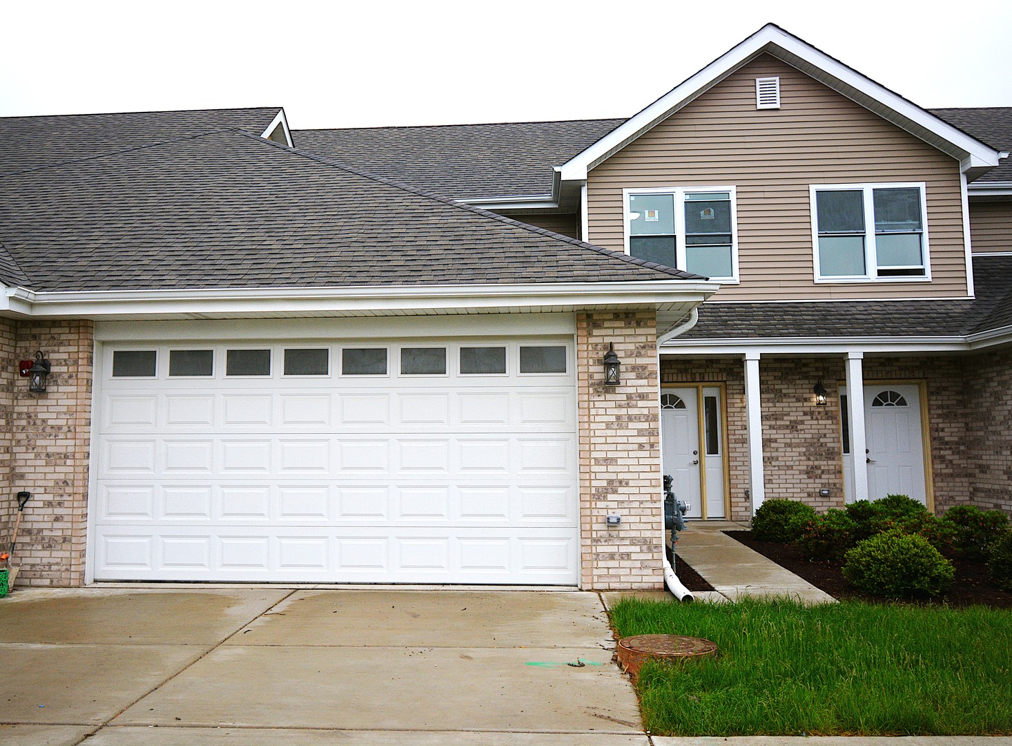 7431 Covington Place Justice, IL 60458 - Photo 2 of 23 a front view of a house with a yard and garage