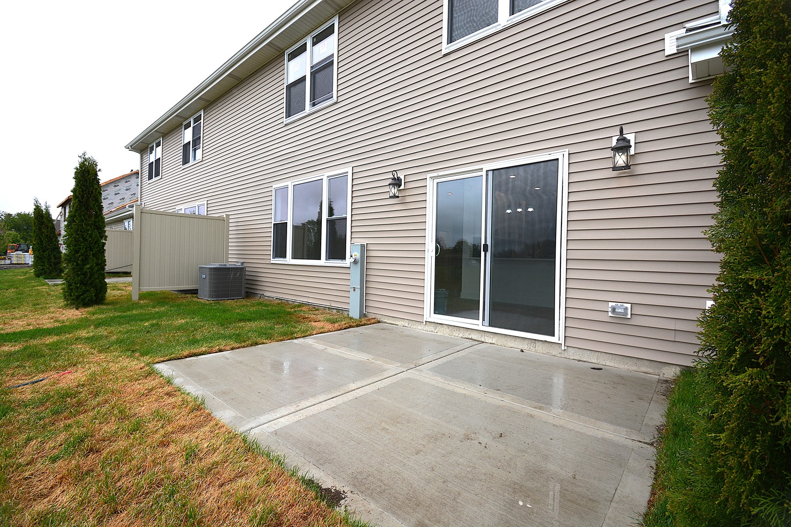 7431 Covington Place Justice, IL 60458 - Photo 22 of 23 a view of a white house with a yard and a garage
