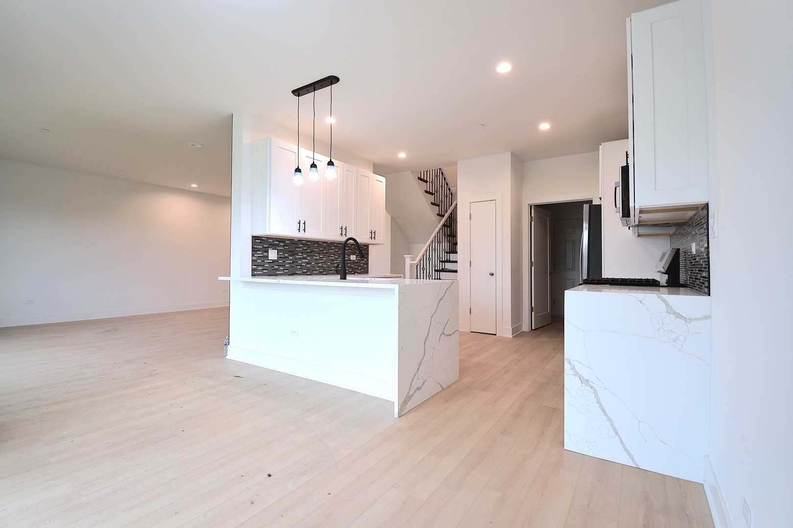 7431 Covington Place Justice, IL 60458 - Photo 6 of 23 a view of a kitchen with refrigerator and a living room
