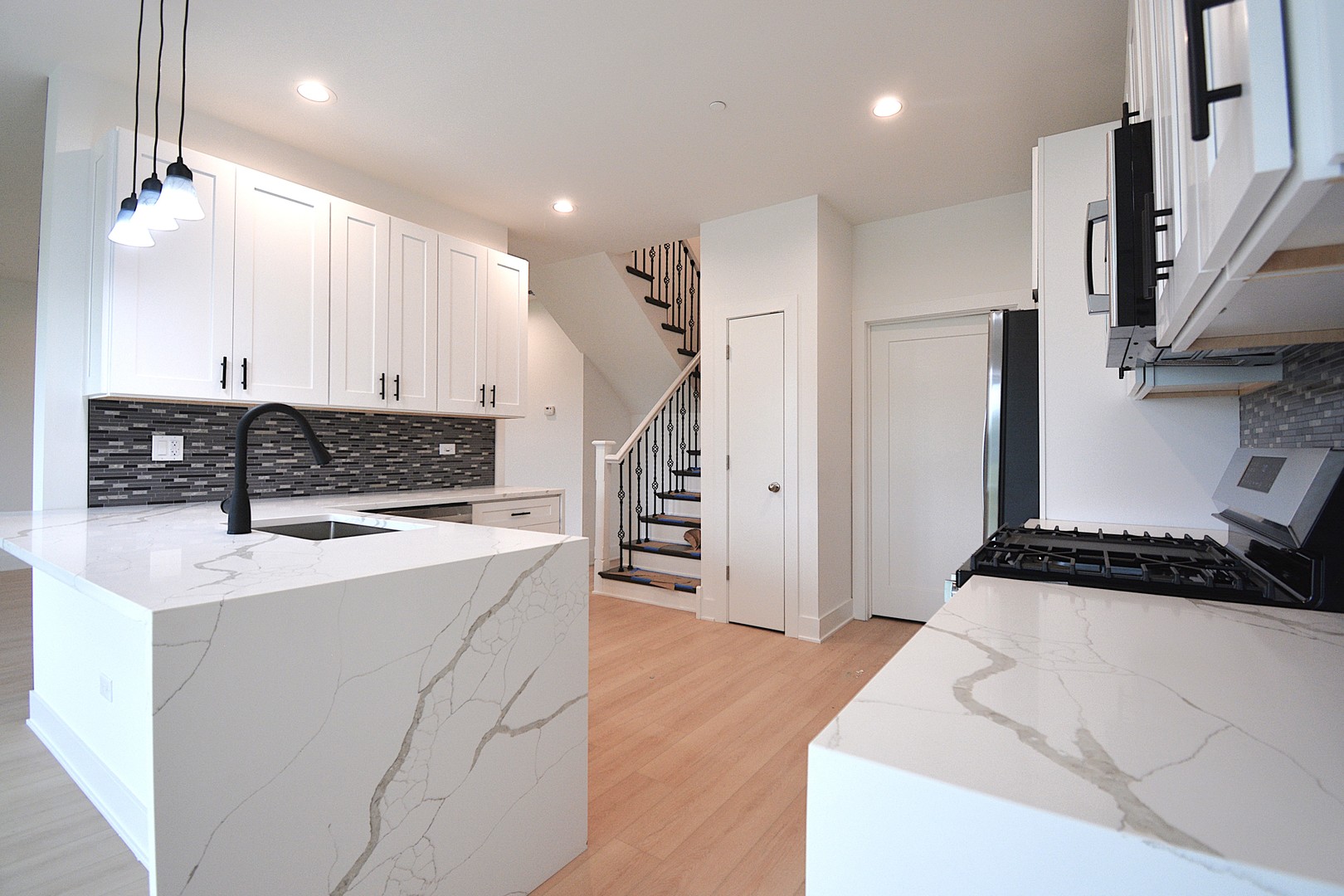 7431 Covington Place Justice, IL 60458 - Photo 7 of 23 a kitchen with stainless steel appliances sink refrigerator and stove