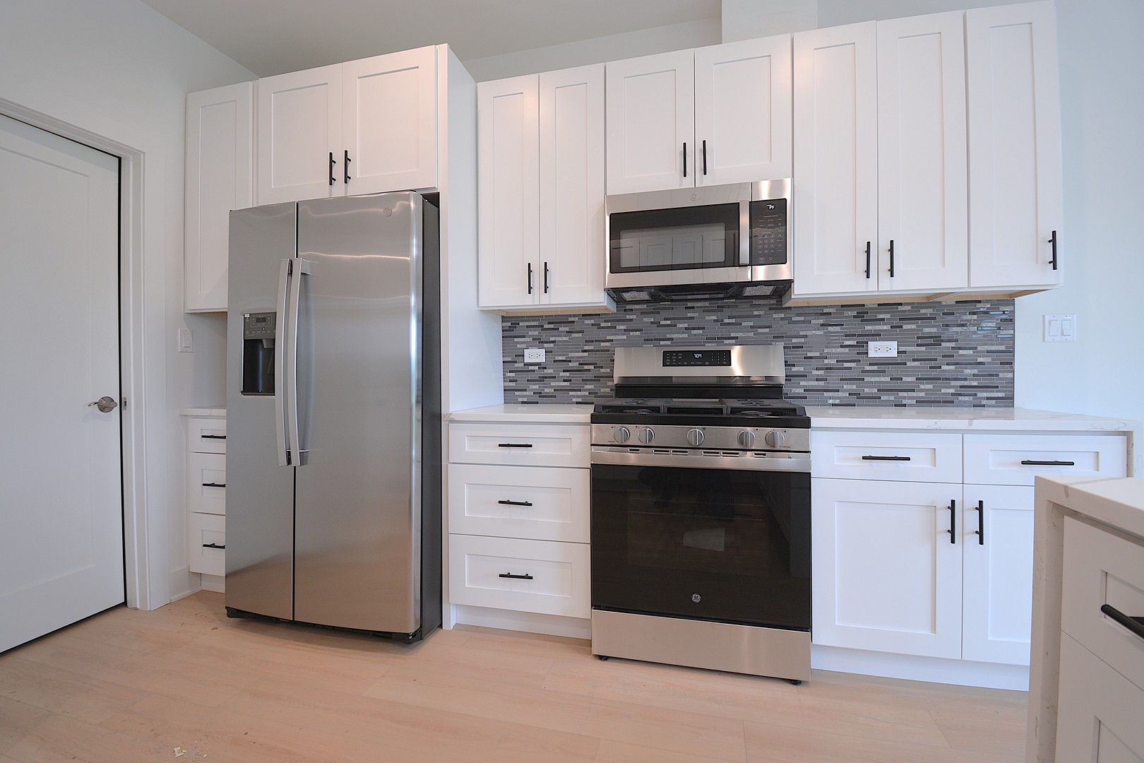 7431 Covington Place Justice, IL 60458 - Photo 10 of 23 a kitchen with cabinets stainless steel appliances and a counter space
