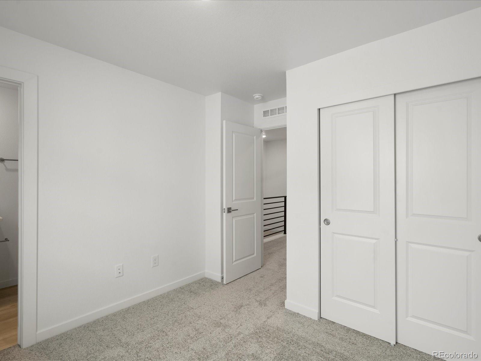 2046 South Holly Street, Unit 1 Denver, CO 80222 - Photo 21 of 31 an empty room with closet area