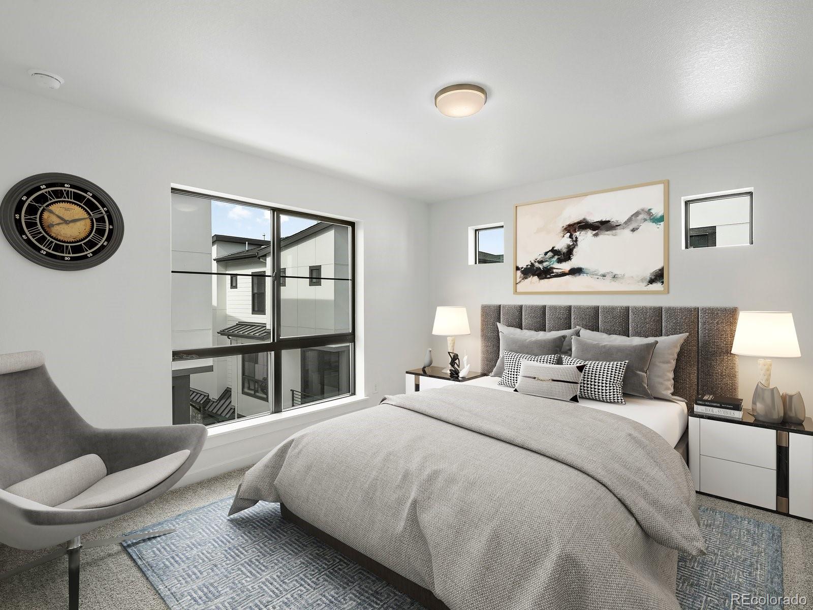 2046 South Holly Street, Unit 1 Denver, CO 80222 - Photo 23 of 31 a bedroom with a bed and a chair