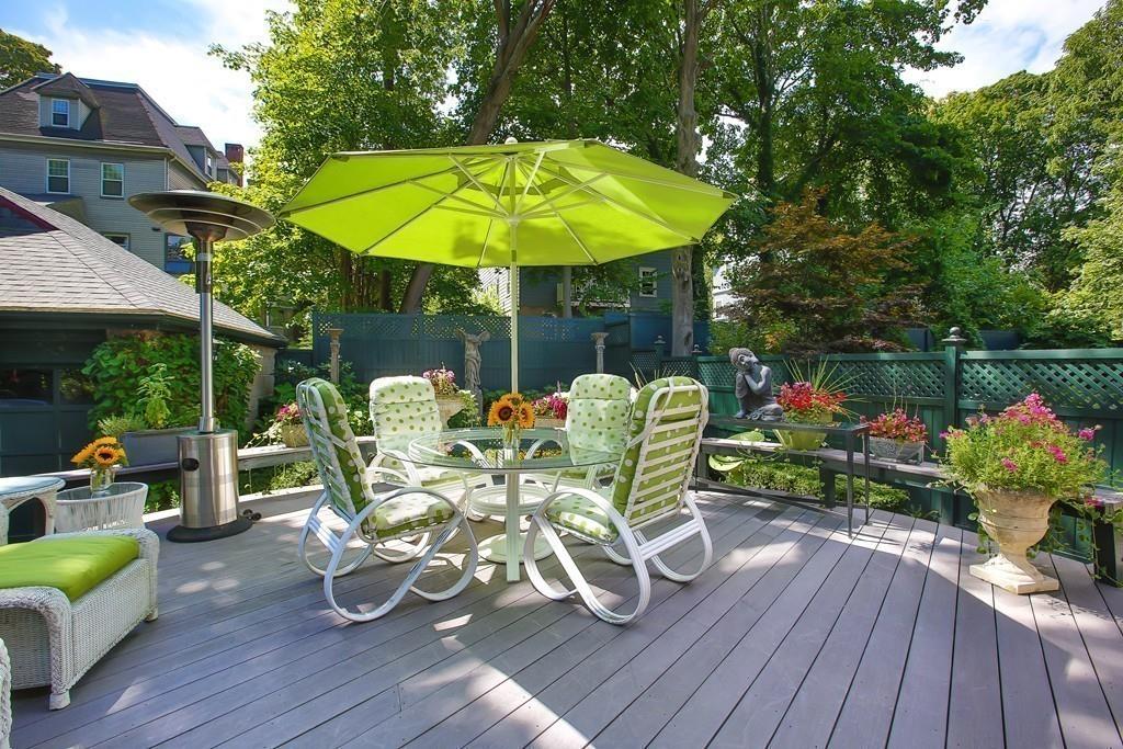 46 Griggs Road Brookline, MA 02446 - Photo 12 of 12 a view of a chair and table on the wooden deck