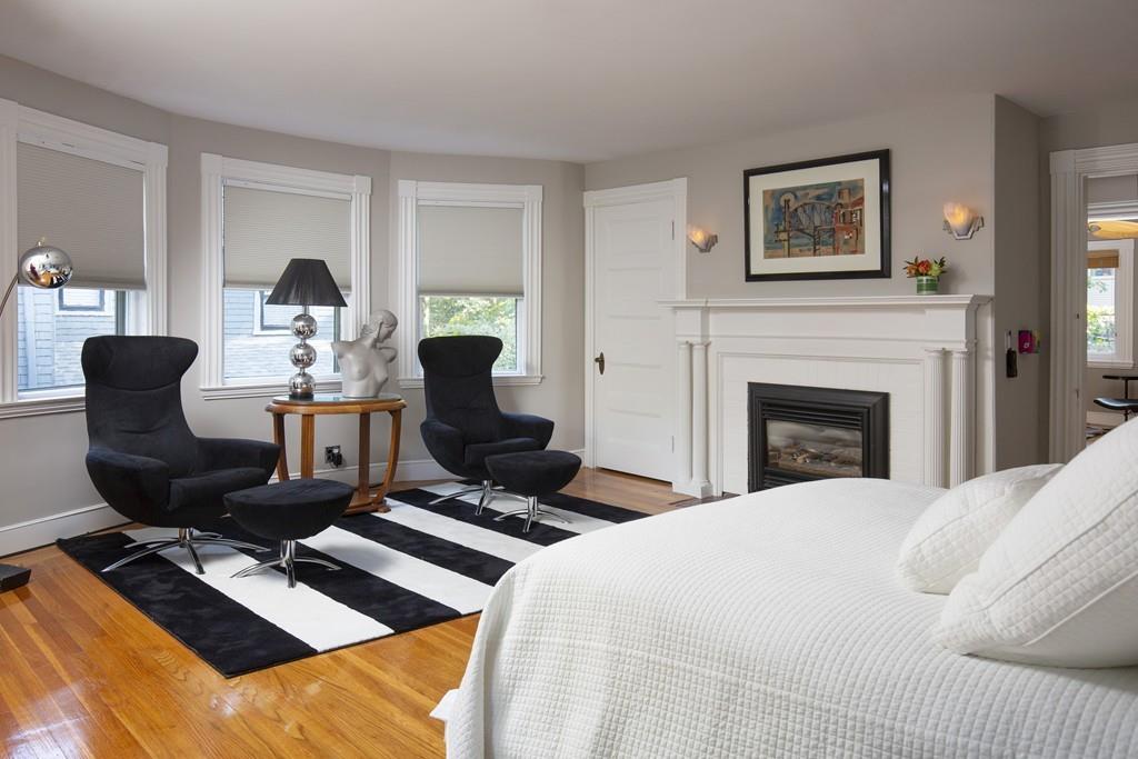 46 Griggs Road Brookline, MA 02446 - Photo 5 of 12 a bed room with a bed furniture and a fireplace