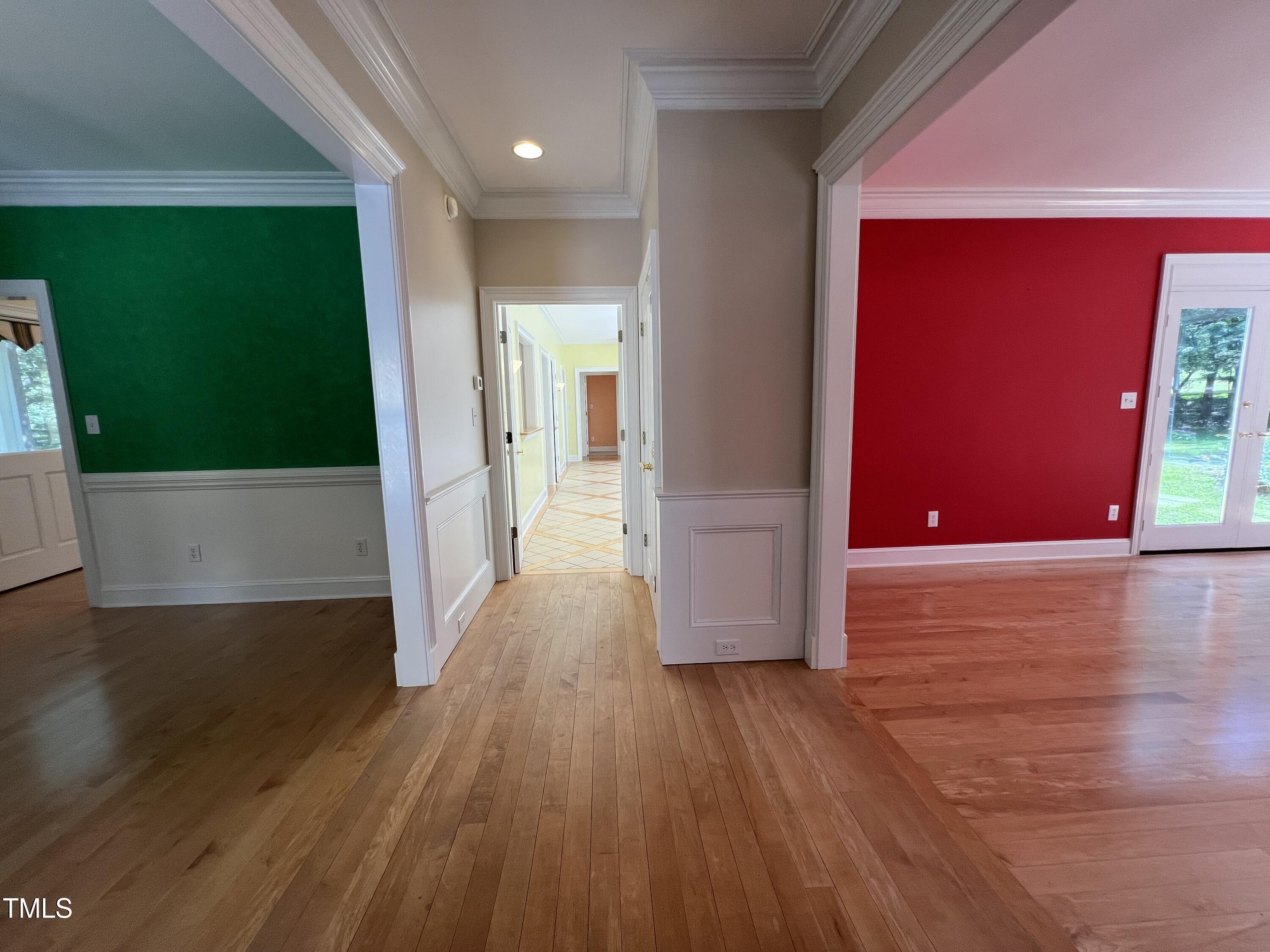 1208 Goodwin Road Apex, NC 27523 - Photo 11 of 42 a view of a hallway with wooden floor
