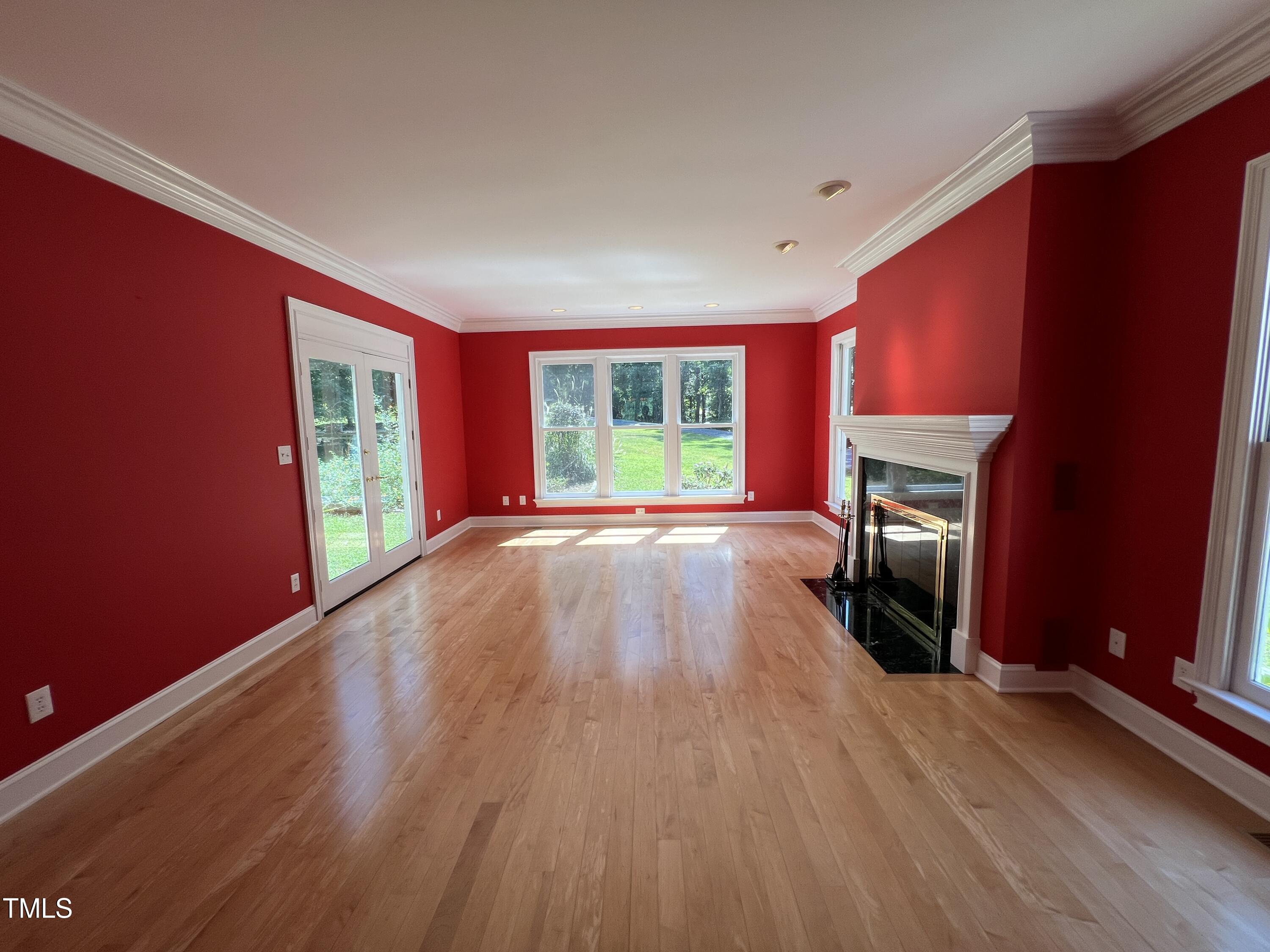 1208 Goodwin Road Apex, NC 27523 - Photo 12 of 42 a view of empty room with wooden floor and fan