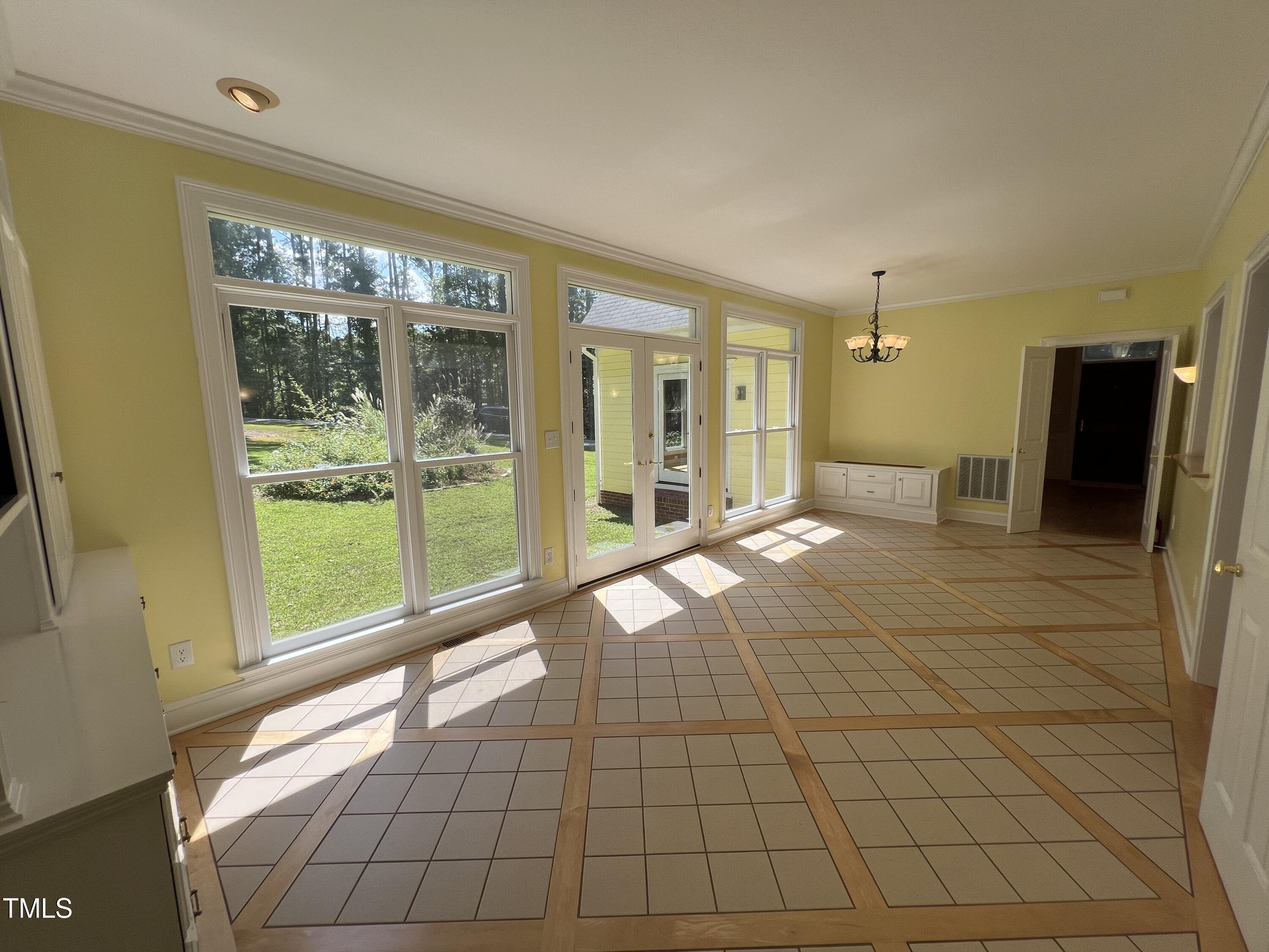 1208 Goodwin Road Apex, NC 27523 - Photo 26 of 42 a view of an empty room with glass door