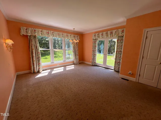 a view of empty room with floor to ceiling window