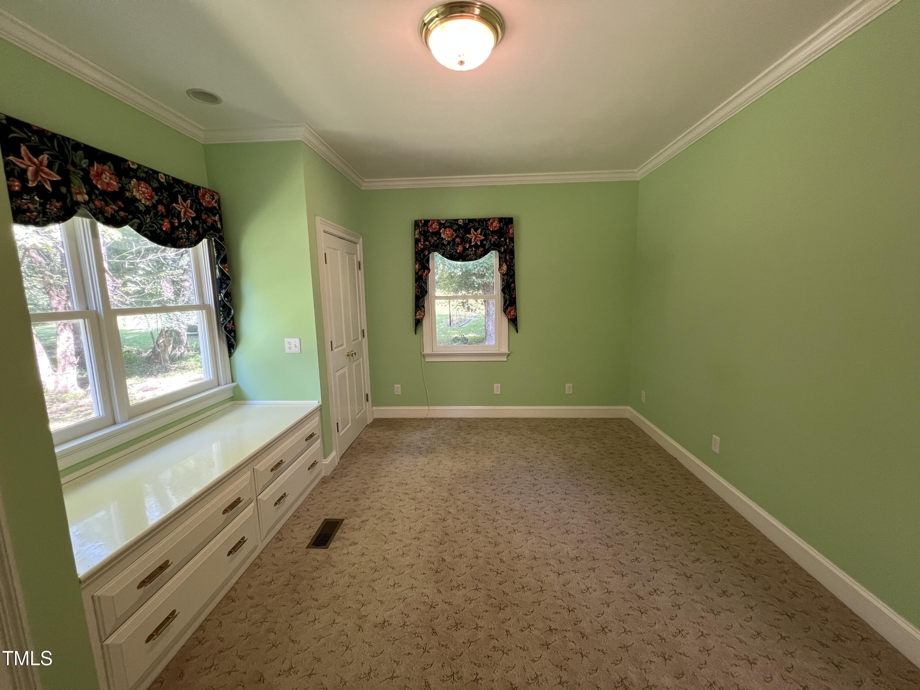 1208 Goodwin Road Apex, NC 27523 - Photo 32 of 42 a view of an empty room and window