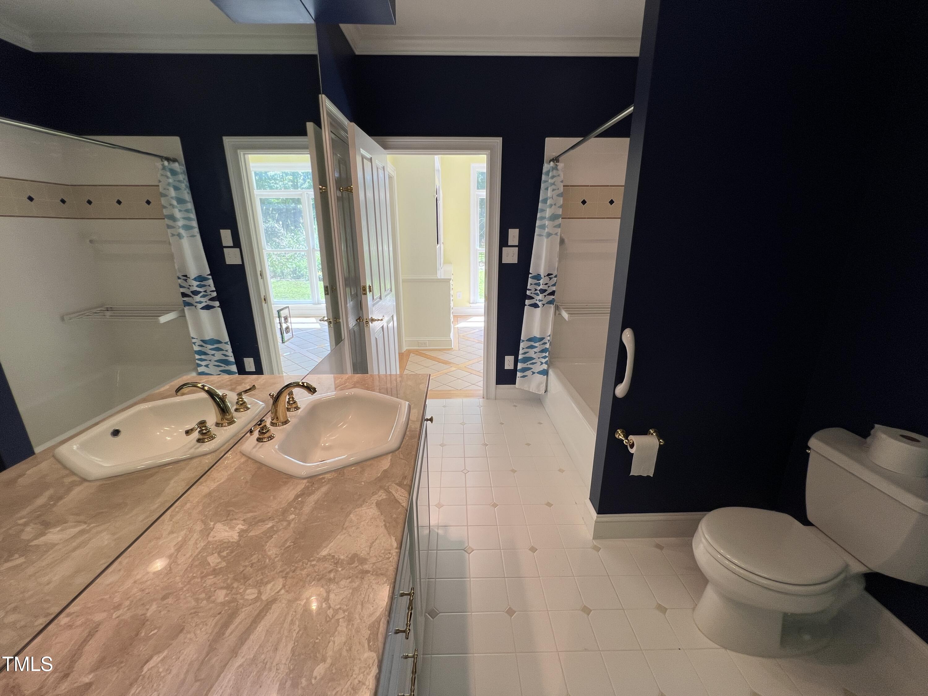 1208 Goodwin Road Apex, NC 27523 - Photo 35 of 42 a spacious bathroom with a bathtub sink and toilet
