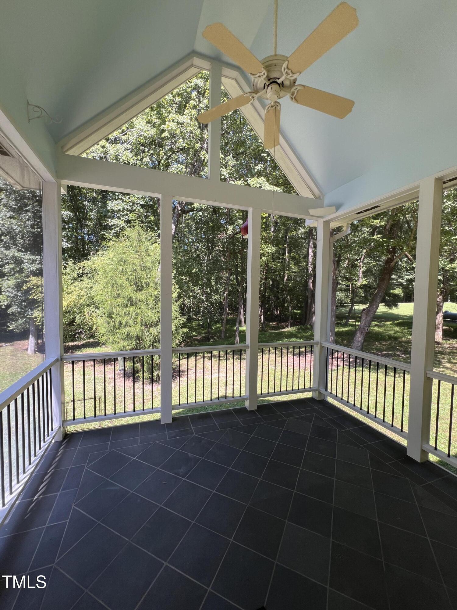 1208 Goodwin Road Apex, NC 27523 - Photo 38 of 42 a view of a porch with wooden floor and iron stairs