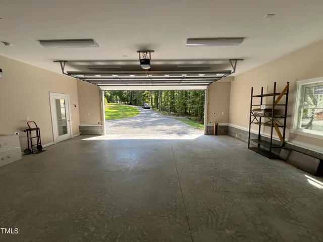 a view of livingroom with an empty space and a fireplace