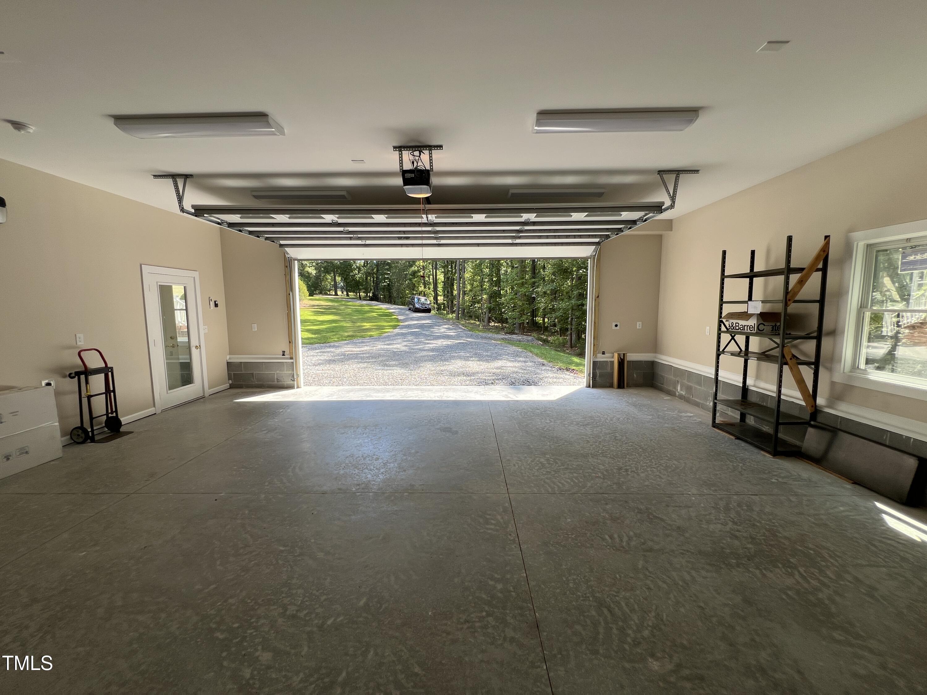 1208 Goodwin Road Apex, NC 27523 - Photo 40 of 42 a view of livingroom with an empty space and a fireplace