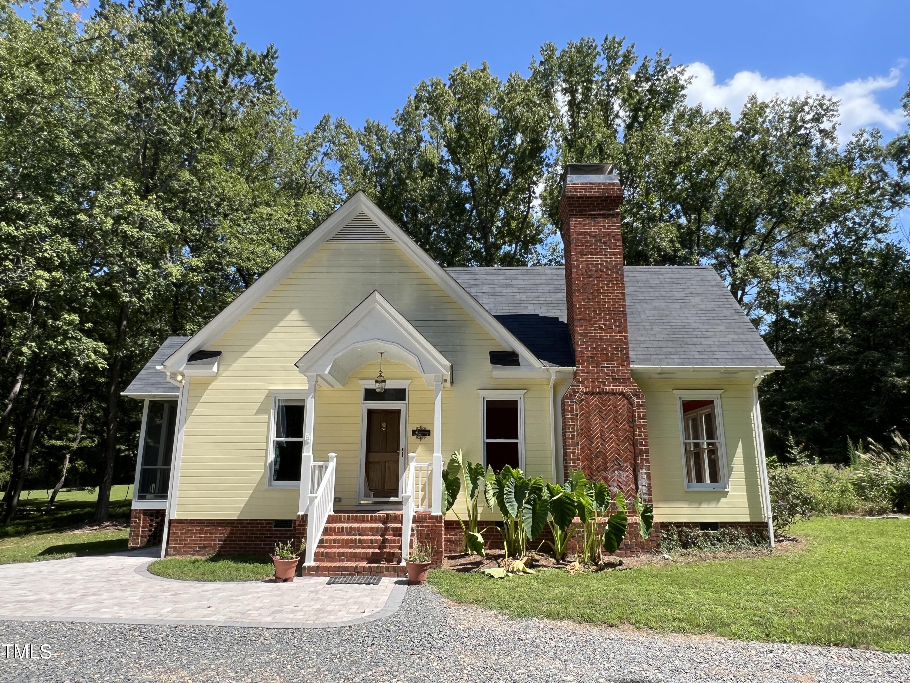 1208 Goodwin Road Apex, NC 27523 - Photo 4 of 42 a front view of a house with a yard