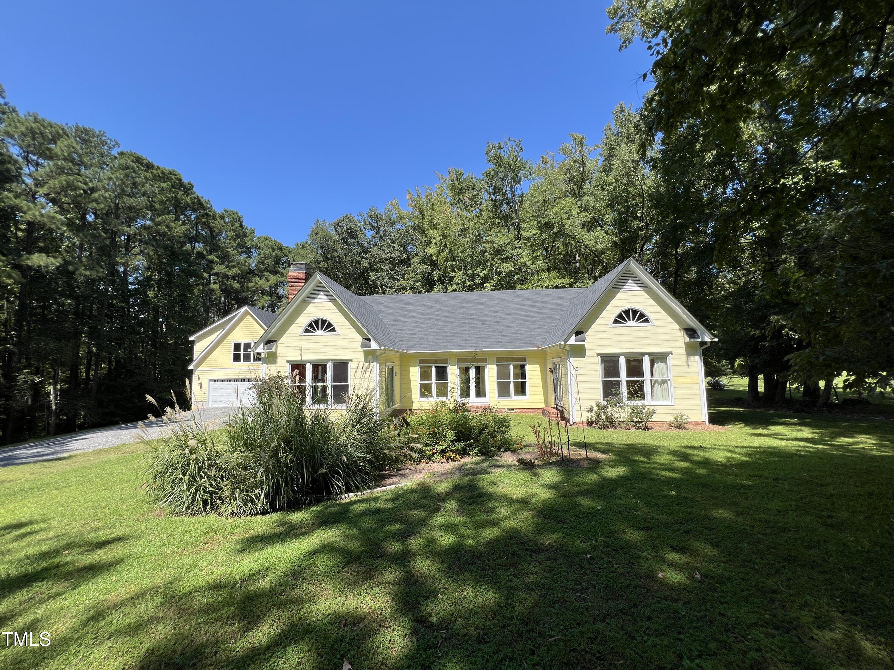 1208 Goodwin Road Apex, NC 27523 - Photo 5 of 42 a front view of a house with a yard