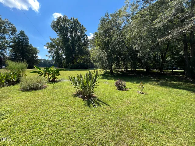 a view of a lake with a yard