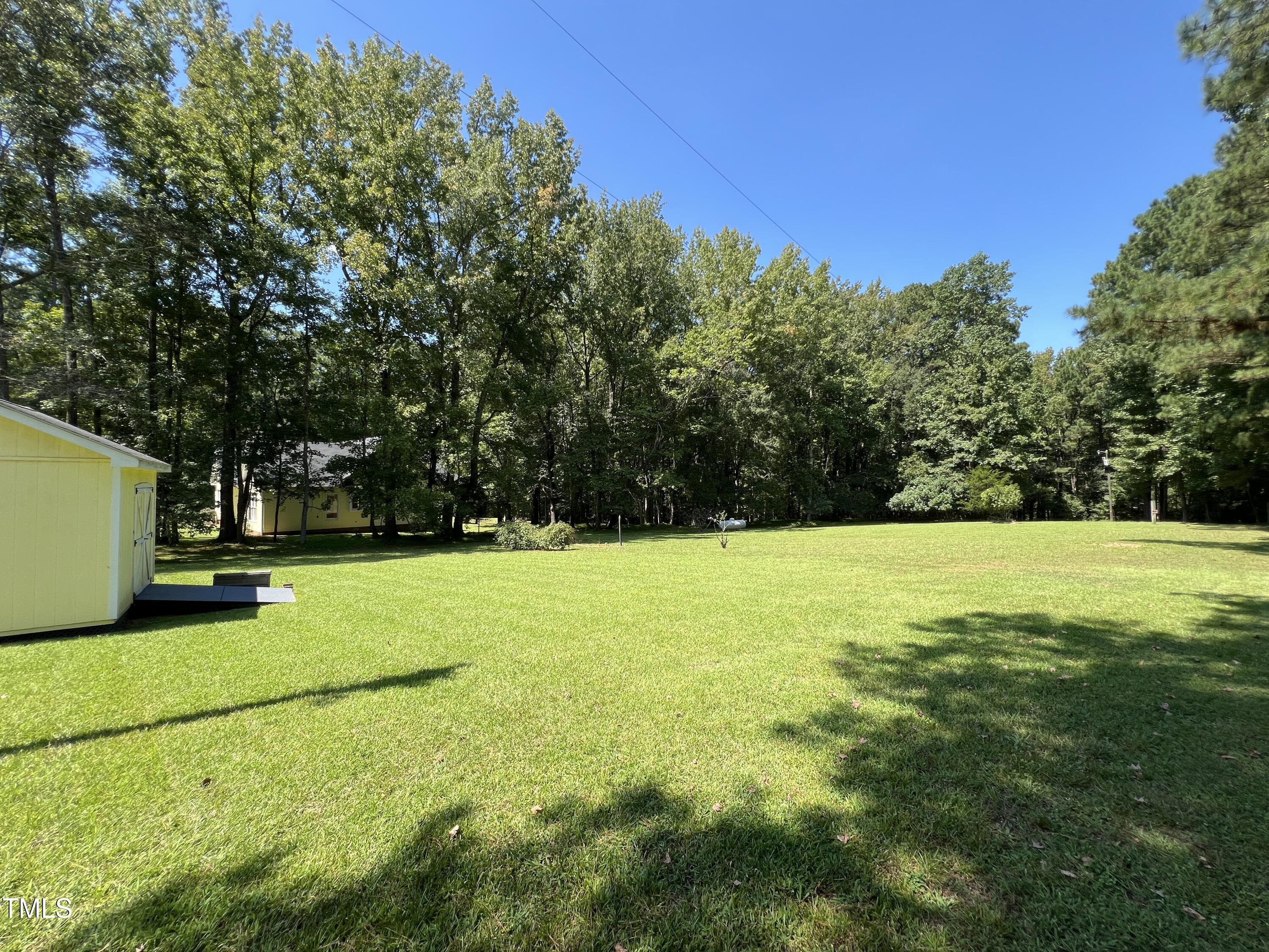 1208 Goodwin Road Apex, NC 27523 - Photo 8 of 42 a view of field with tall trees