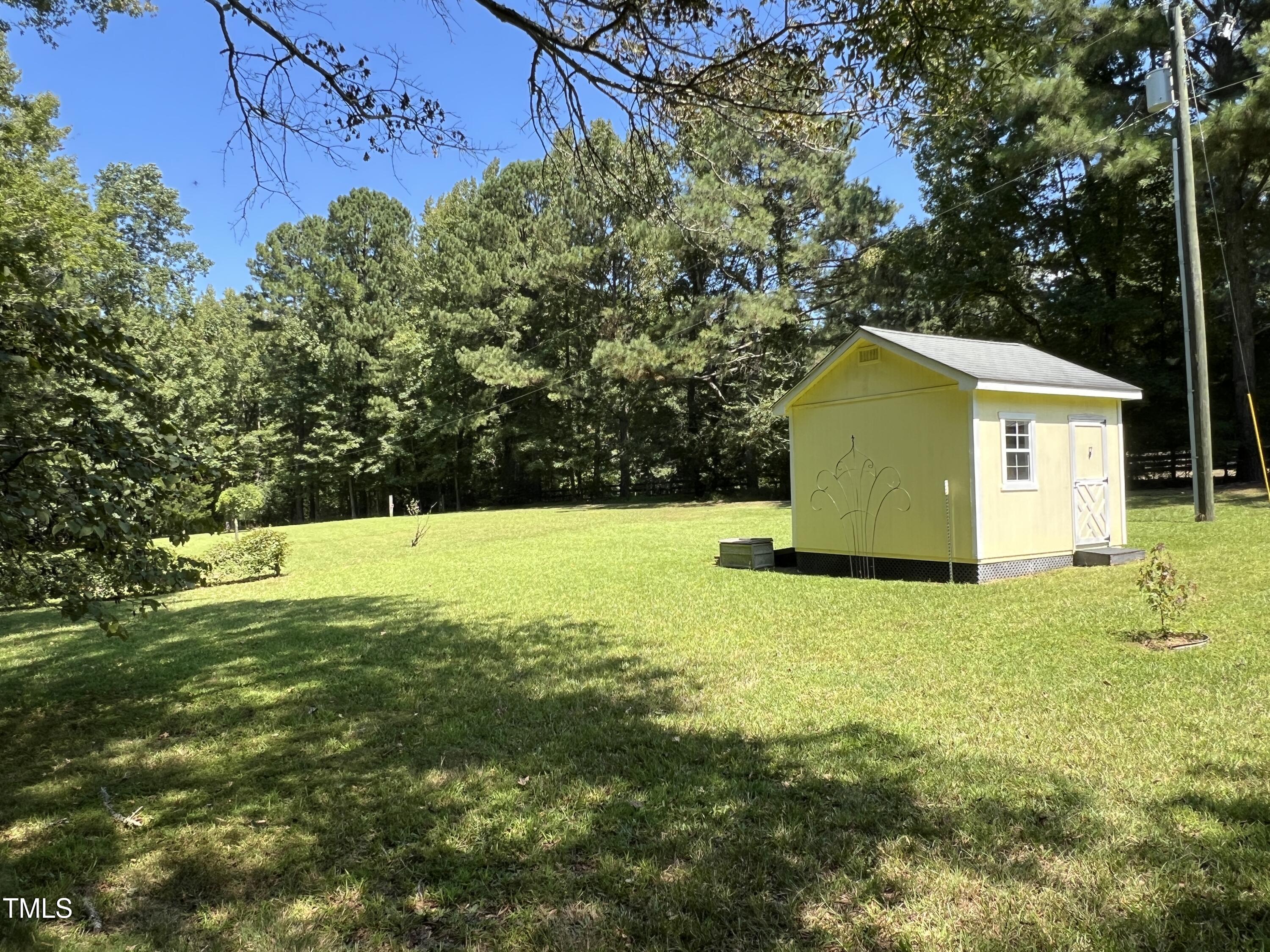 1208 Goodwin Road Apex, NC 27523 - Photo 9 of 42 a view of a house with a yard