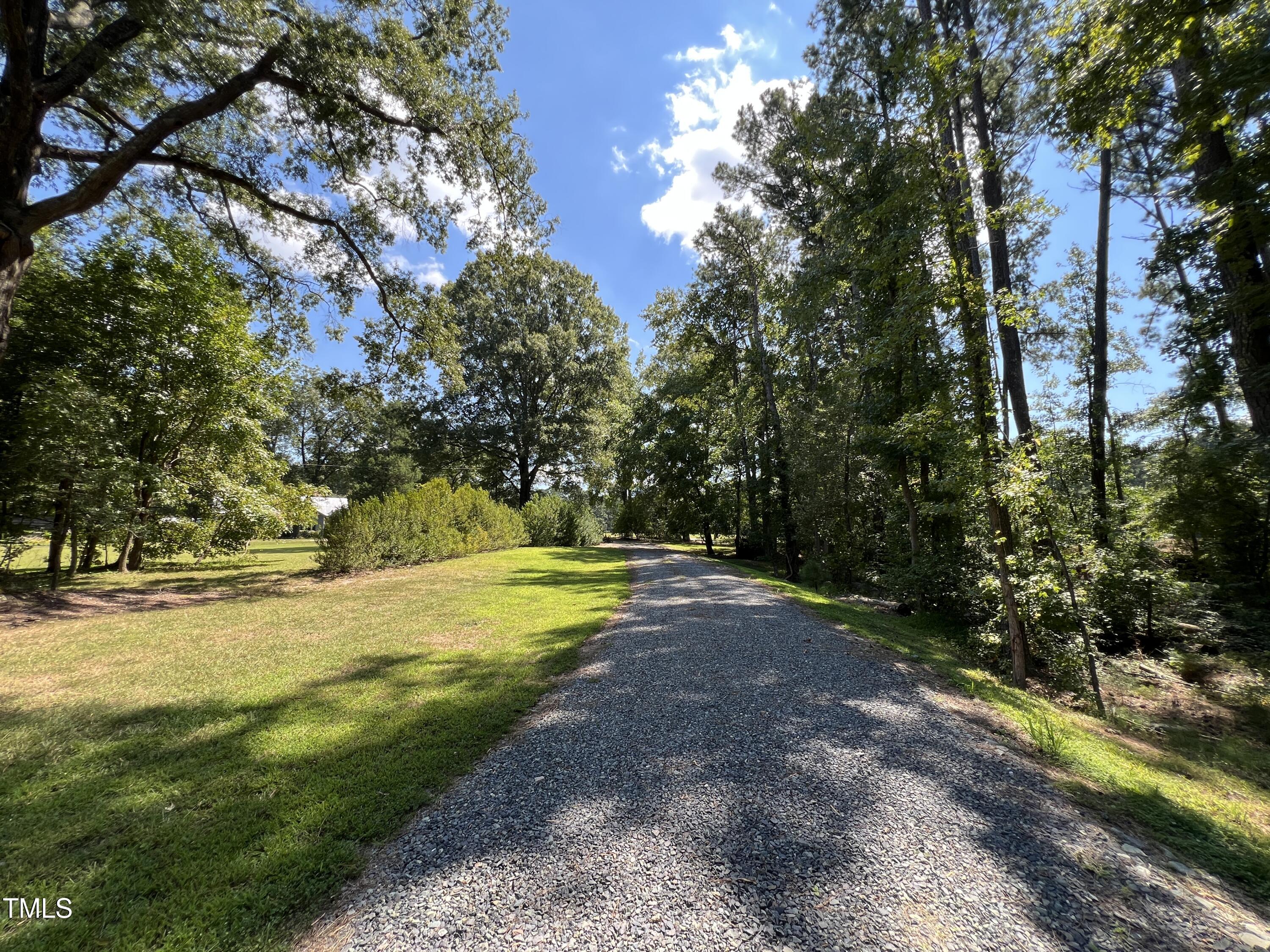 1208 Goodwin Road Apex, NC 27523 - Photo 10 of 42 a view of a yard with a tree