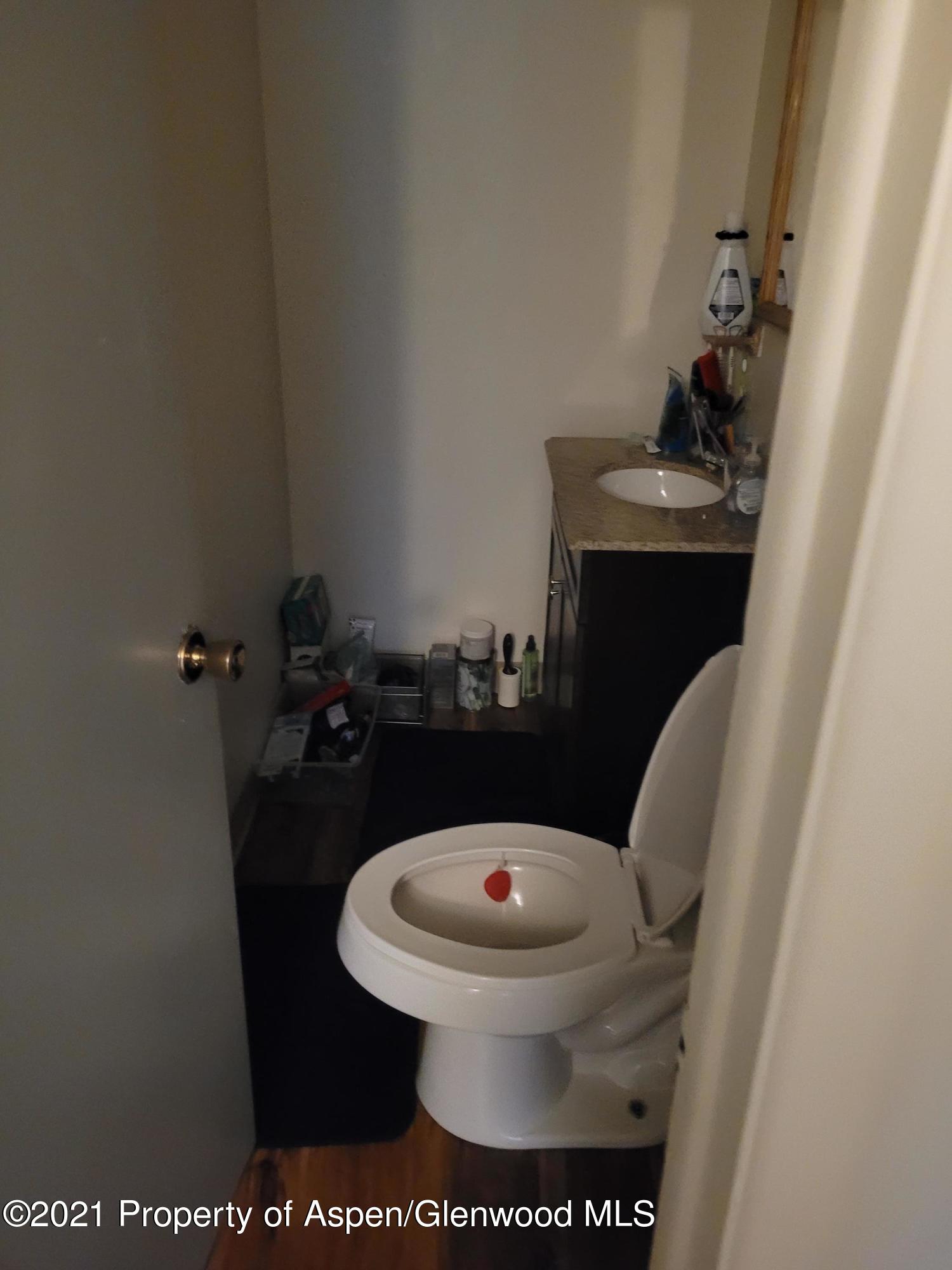 710 East 3rd Street Rifle, CO 81650 - Photo 8 of 9 a bathroom with a toilet and a sink