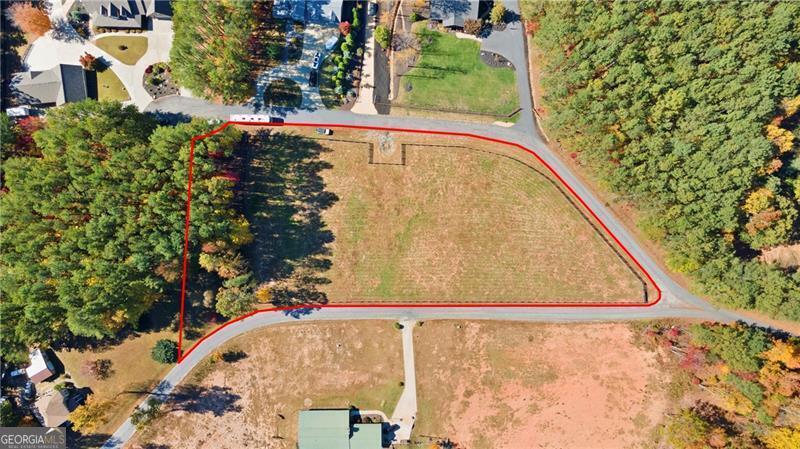 a view of a swimming pool with a yard