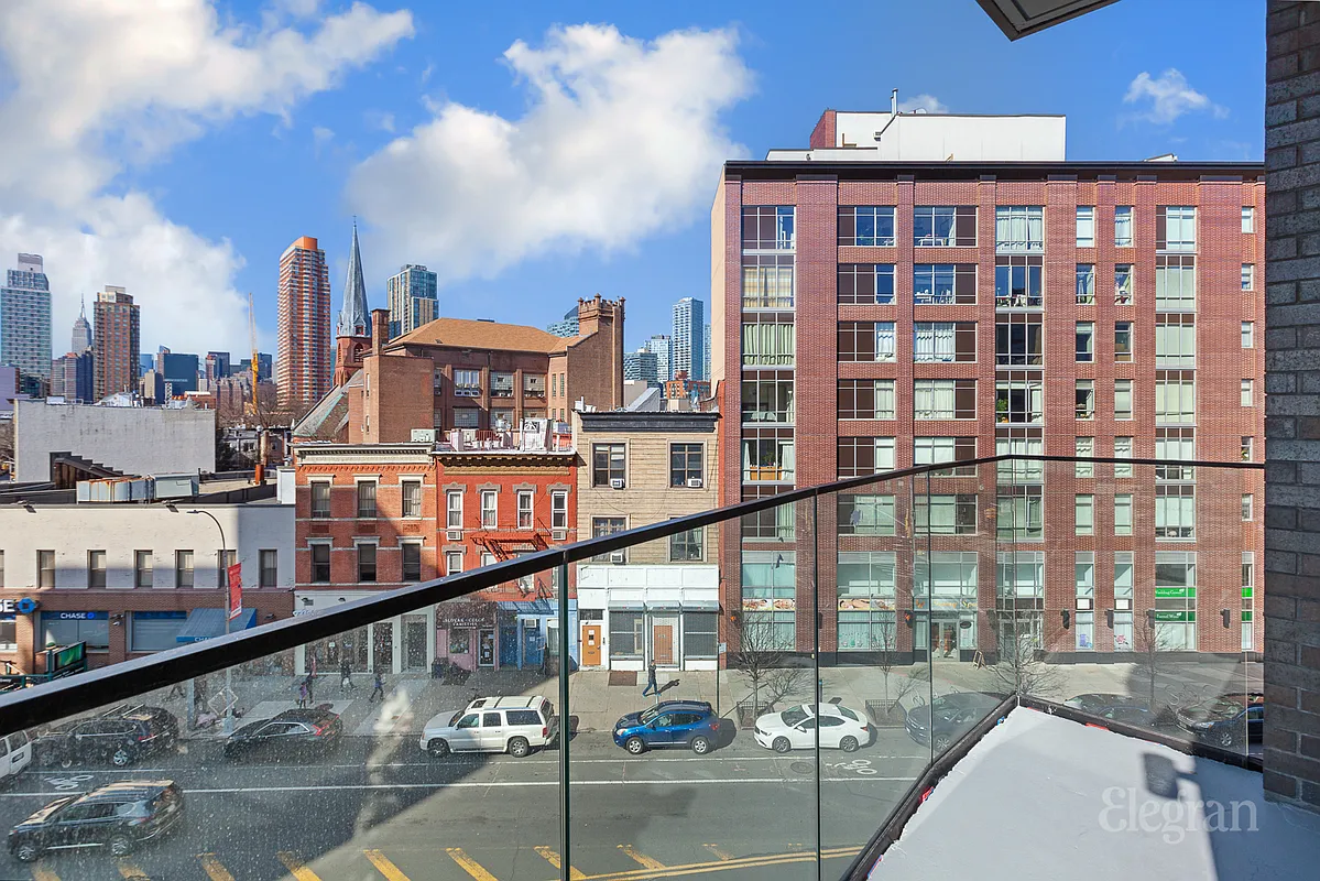 10-64 Jackson Avenue, Unit 4B Queens, NY 11101 - Photo 4 of 10 a view of a building from a balcony