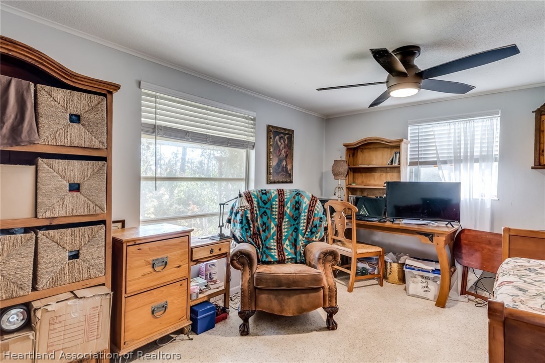 3264 Golfview Road Sebring, FL 33875 - Photo 14 of 27 a view of a livingroom with workspace and a window